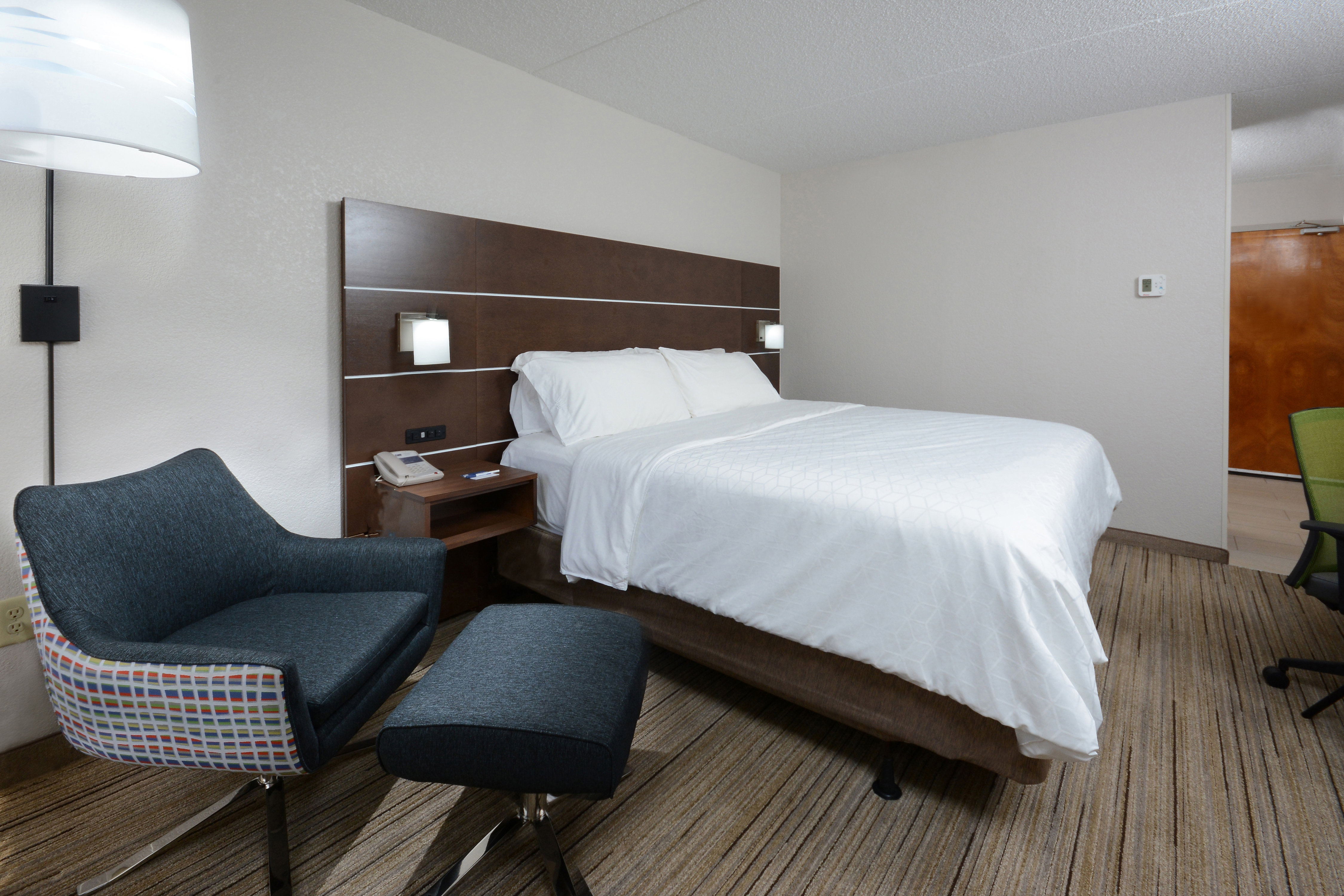 Our King rooms feature a comfortable, modern chair to relax in.
