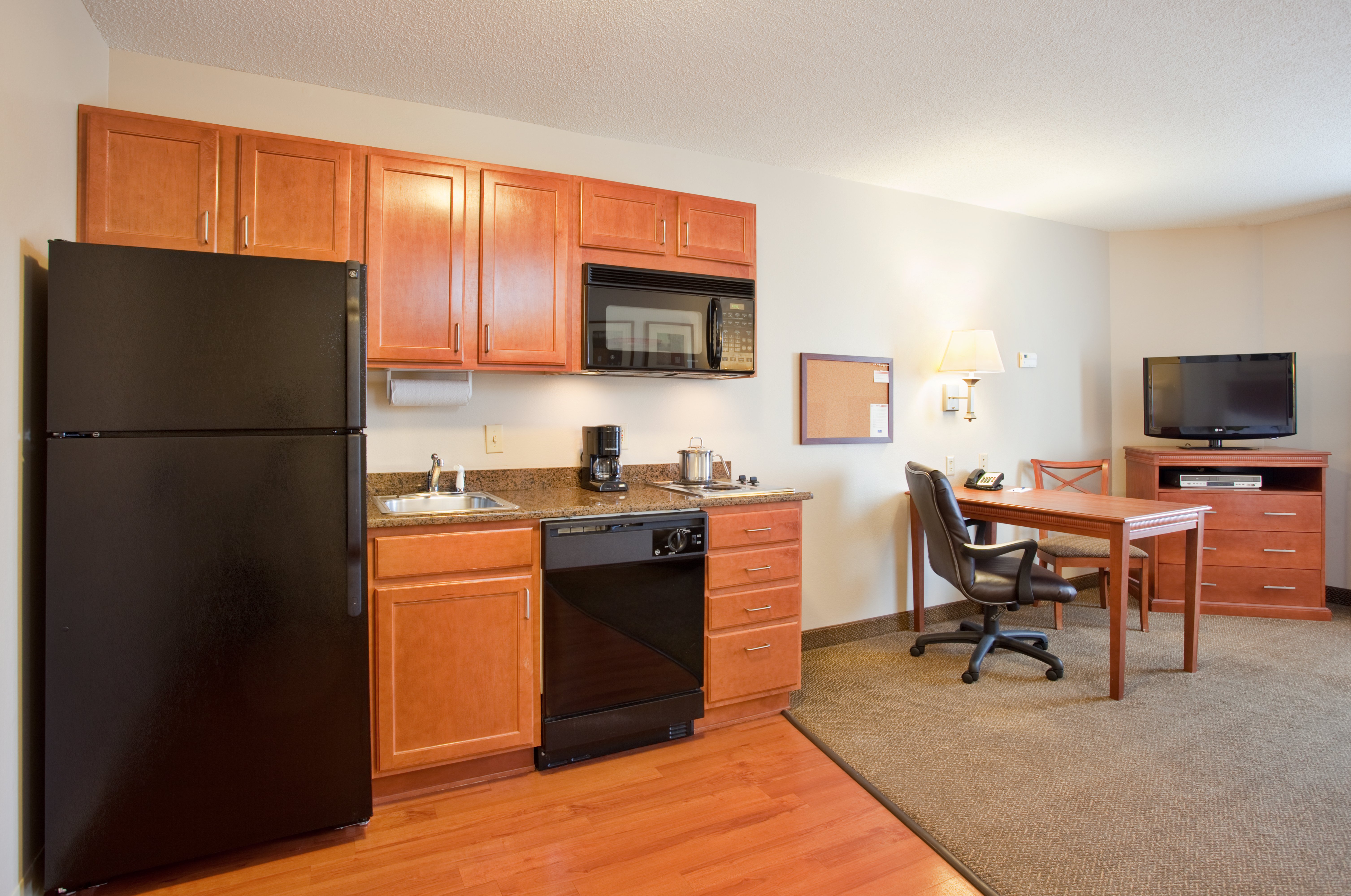 Full kitchen and desk in every suite.