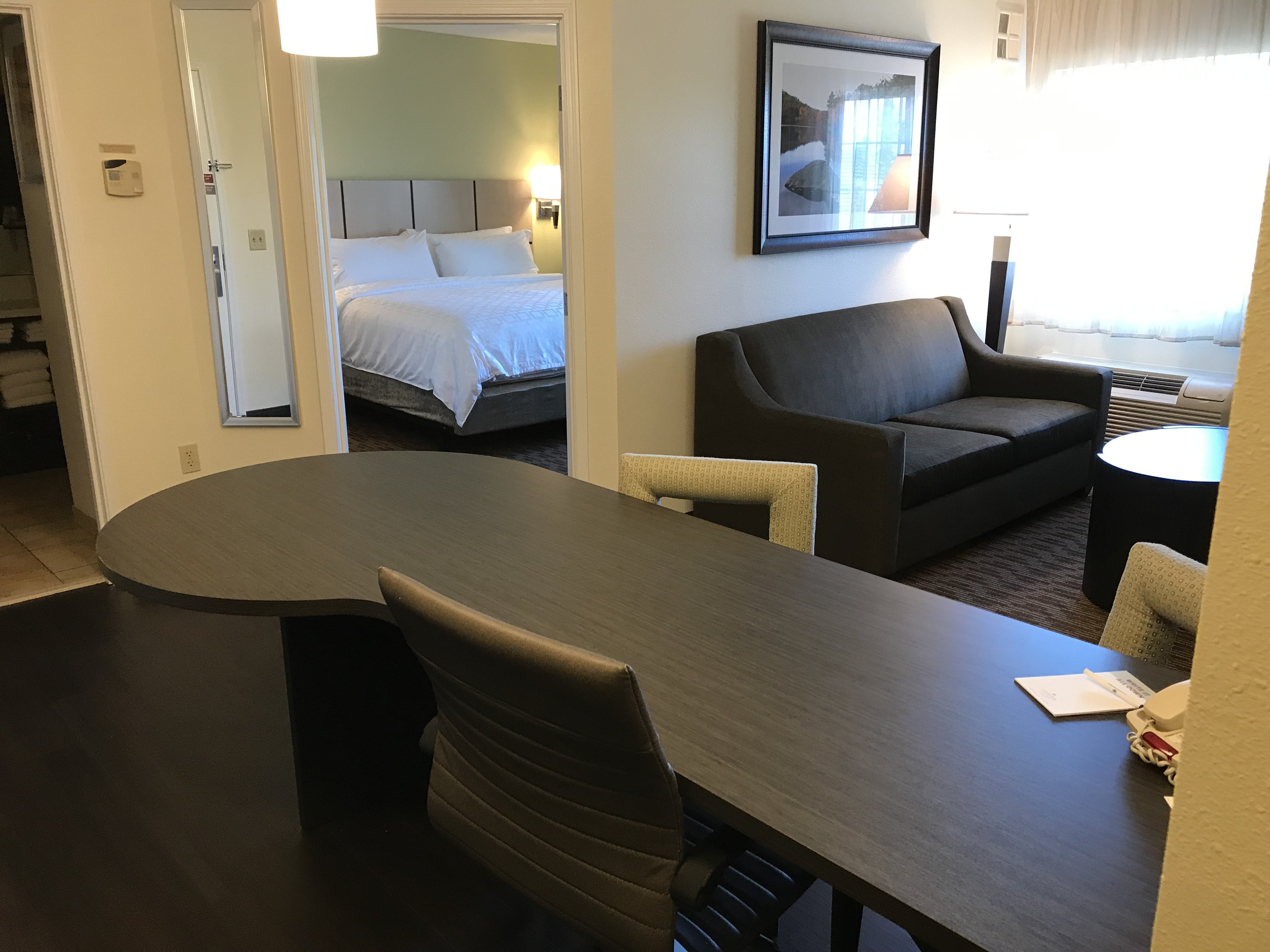 CANDLEWOOD SUITES NW BY IHG-guestroom-1 bedroom suite with a king bed and 2-40" TVs..jpg
