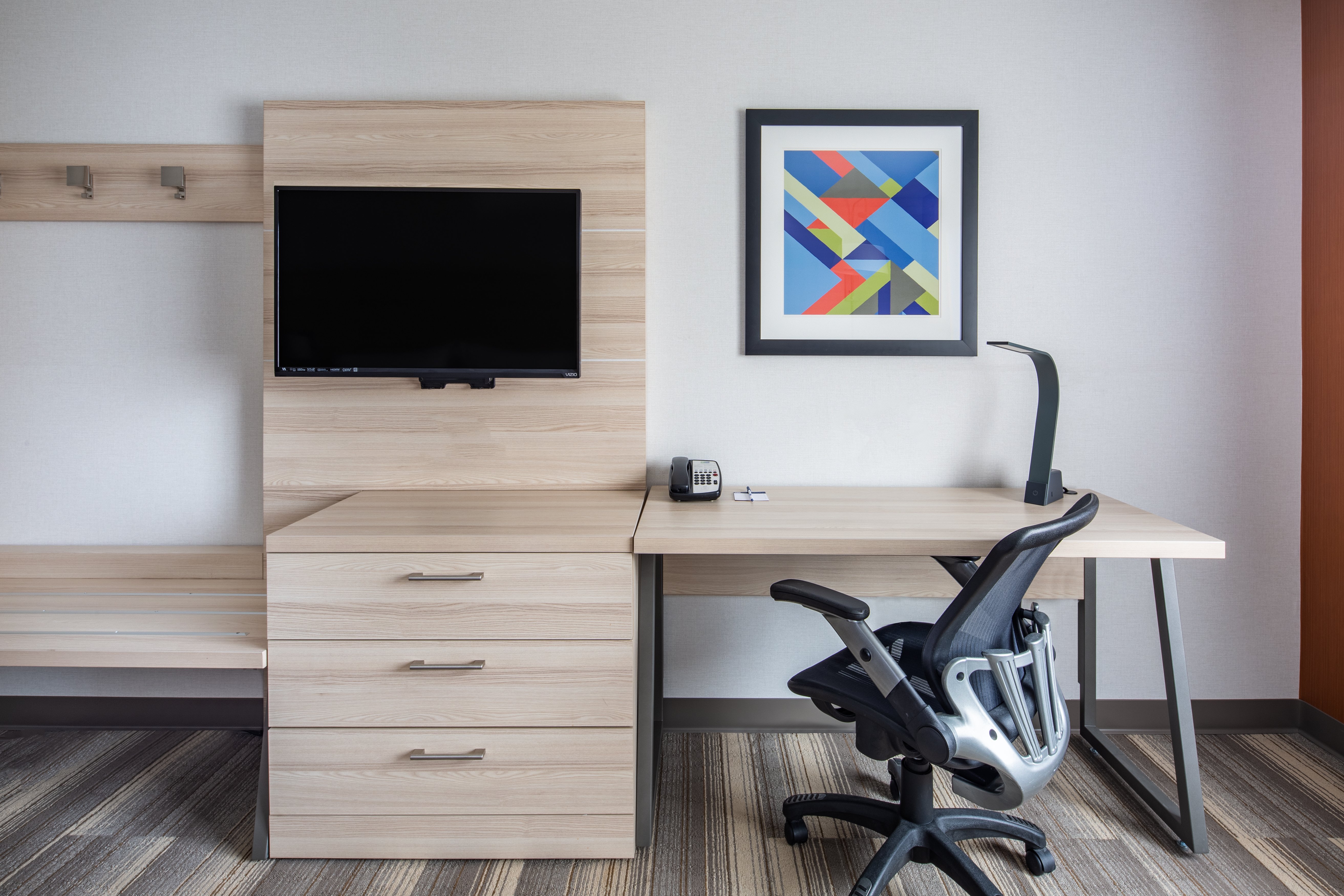 HOLIDAY INN EXP STES AIRPORT BY IHG-guestroom-Unwind in your room while you watch your favorite TV show..jpg