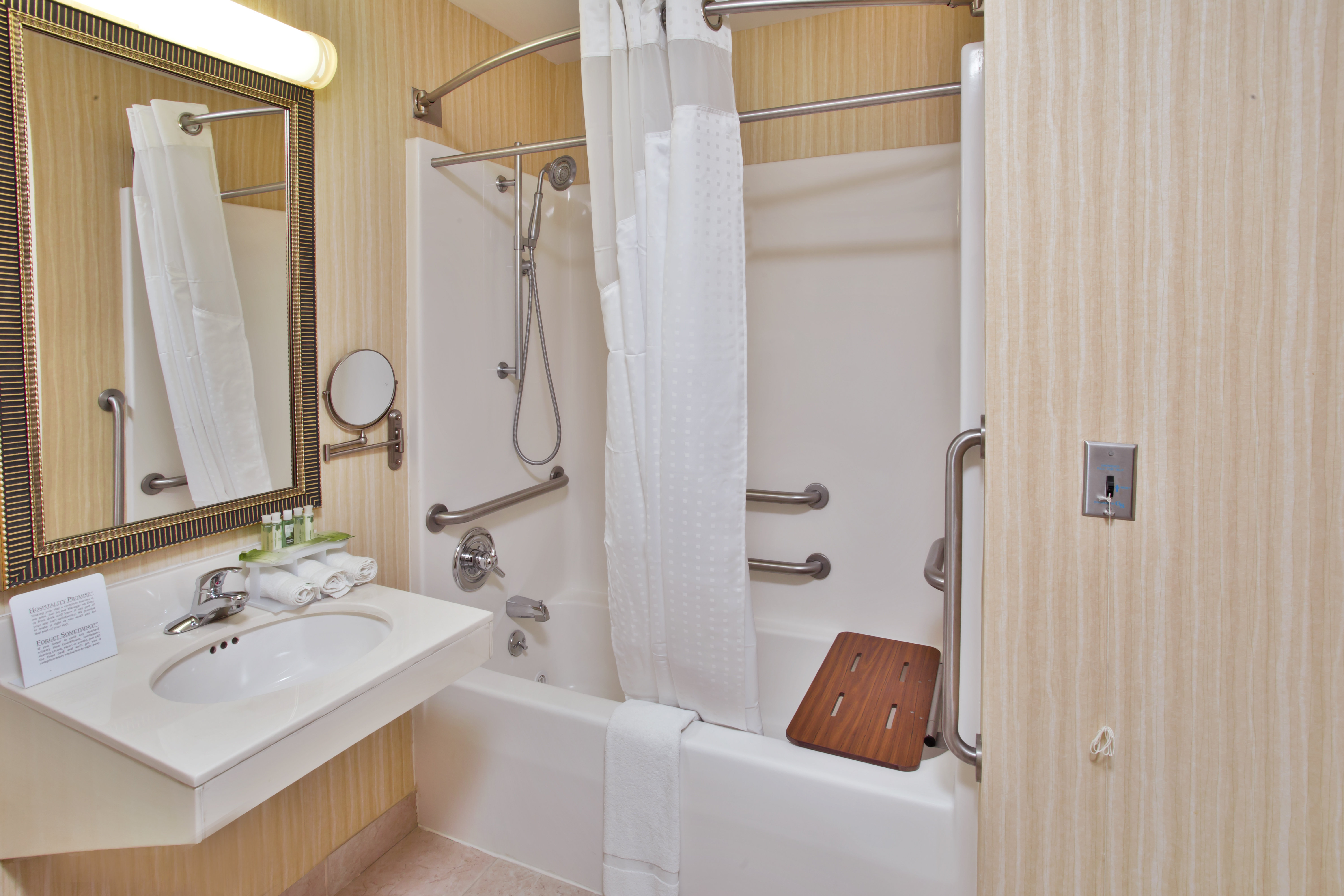 HOLIDAY INN EXP BREAUX BRIDGE BY IH-guestroom-Convenient ADA/Handicapped Accessible Transfer Shower.jpg