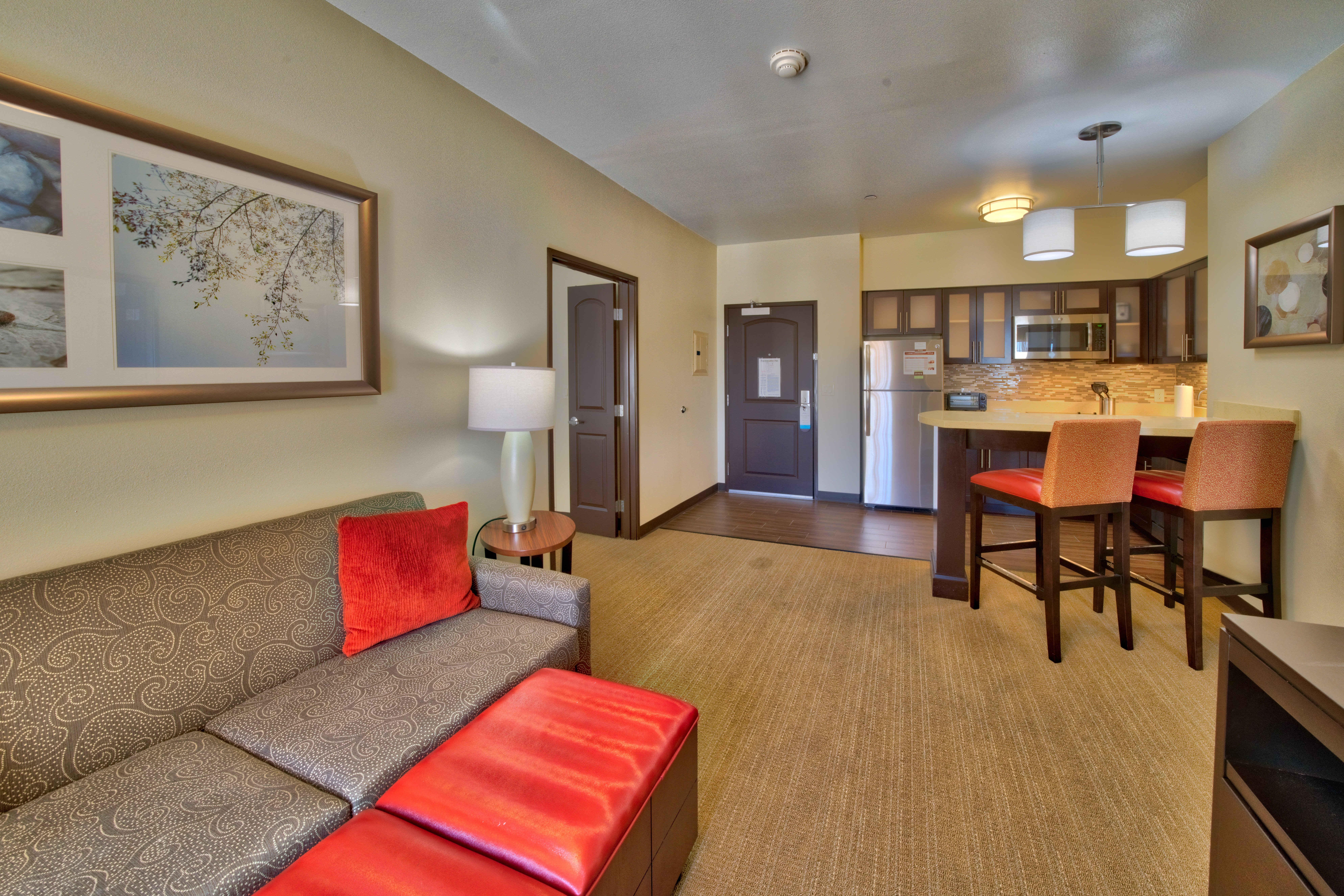 STAYBRIDGE STES SOUTH BY IHG-guestroom-Staybridge Suites Lubbock South 2 BDRM Living Area & Kitchenette.jpg