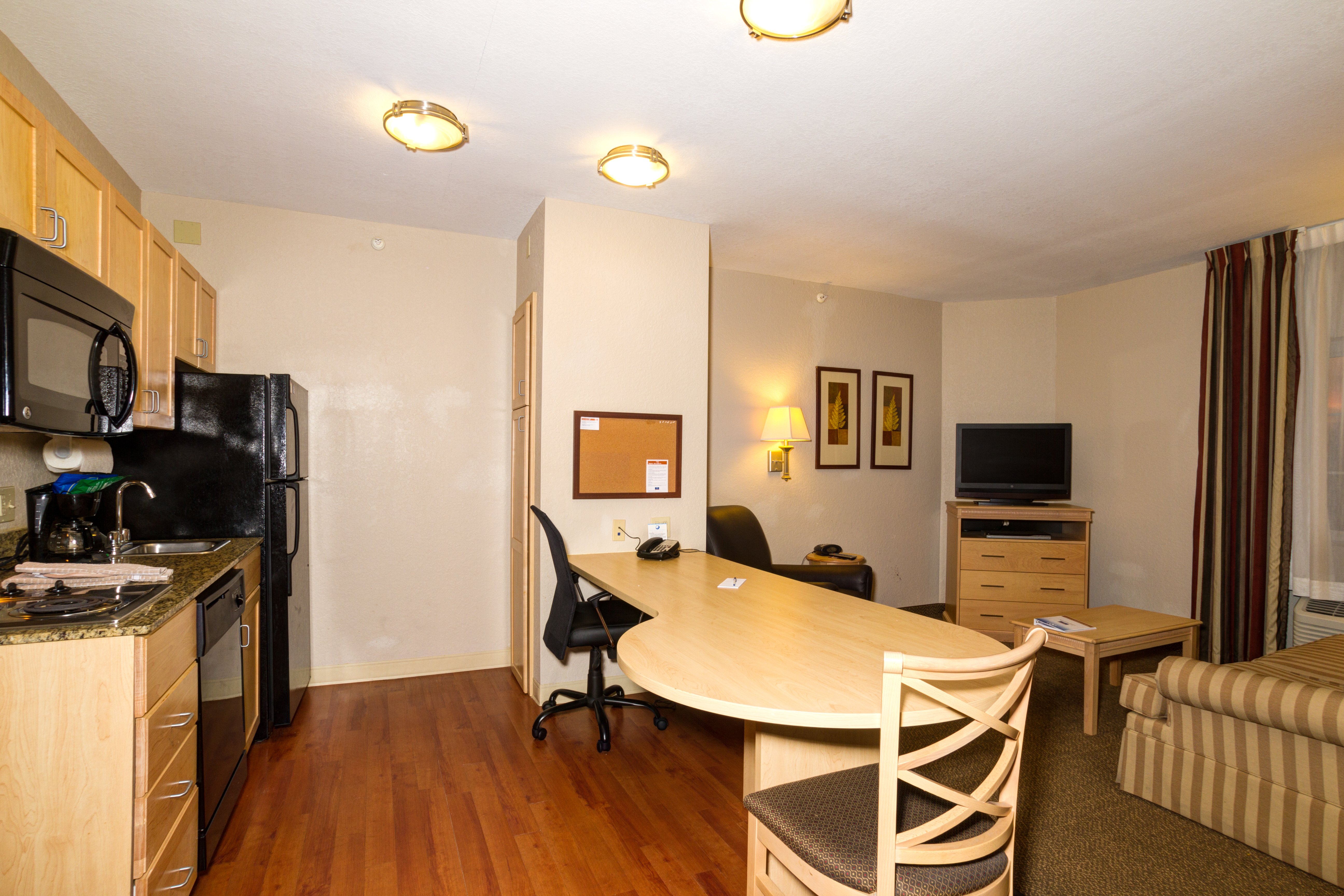 CANDLEWOOD SUITES FT MYERS I75 BY I-guestroom-1 Bedroom suite. 1 Queen size bed, pullout couch Non-Smoking.jpg