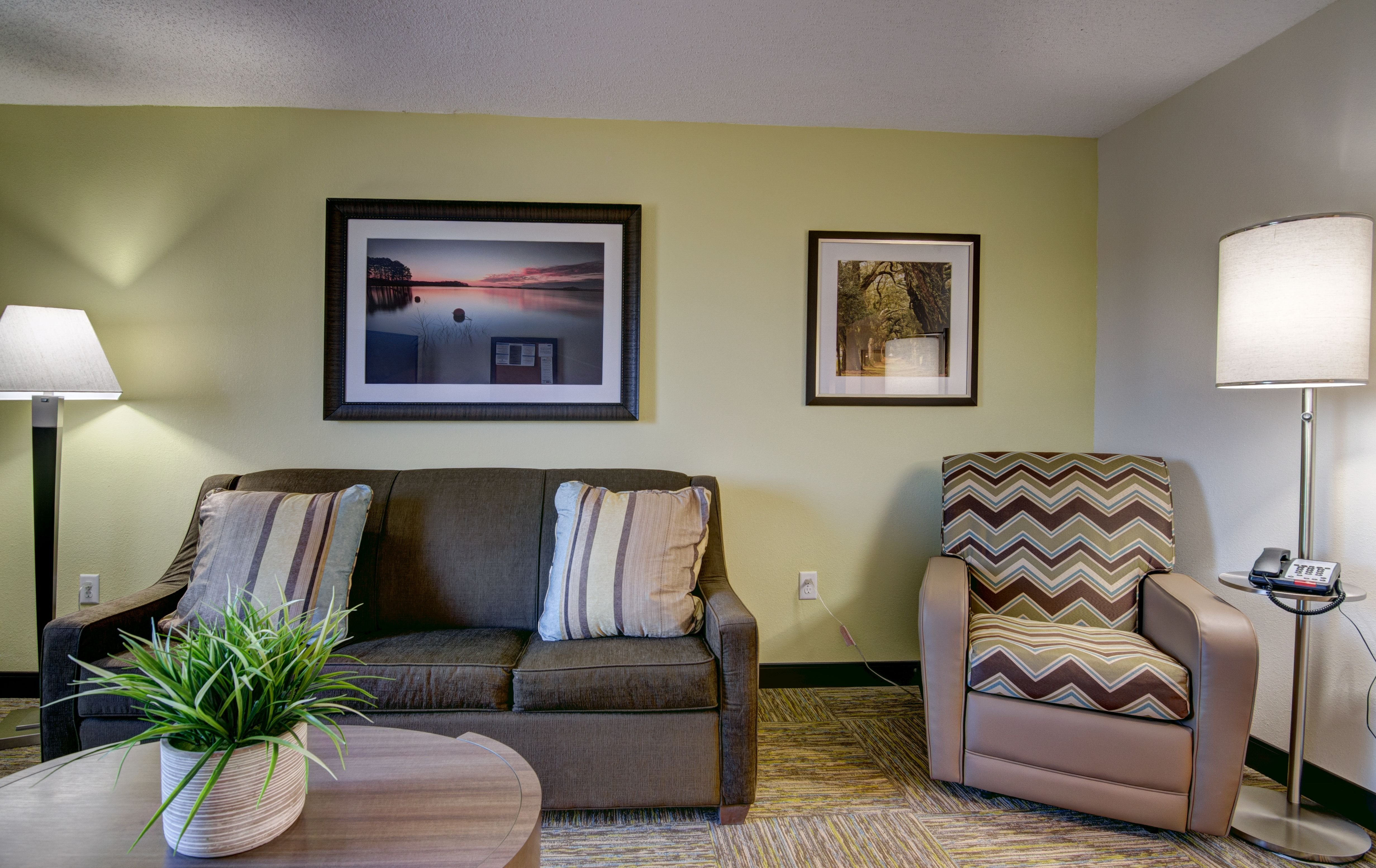CANDLEWOOD STES RICH W BROAD BY IHG-guestroom-Our Living Rooms feature Pull-Out Sofas and Comfy Recliners .jpg