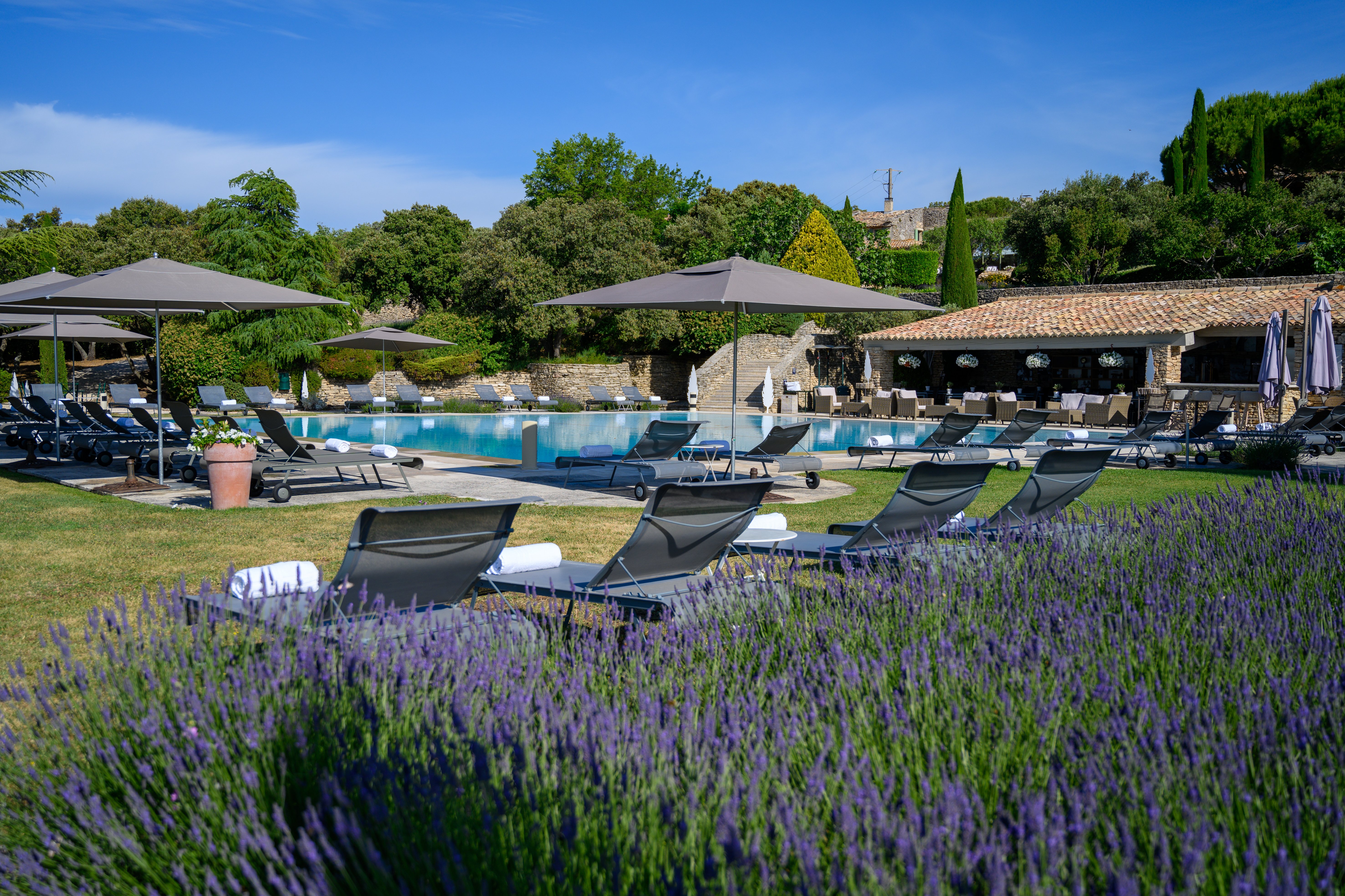 Les Bories-guestroom-Sunbeds by the pool.jpg