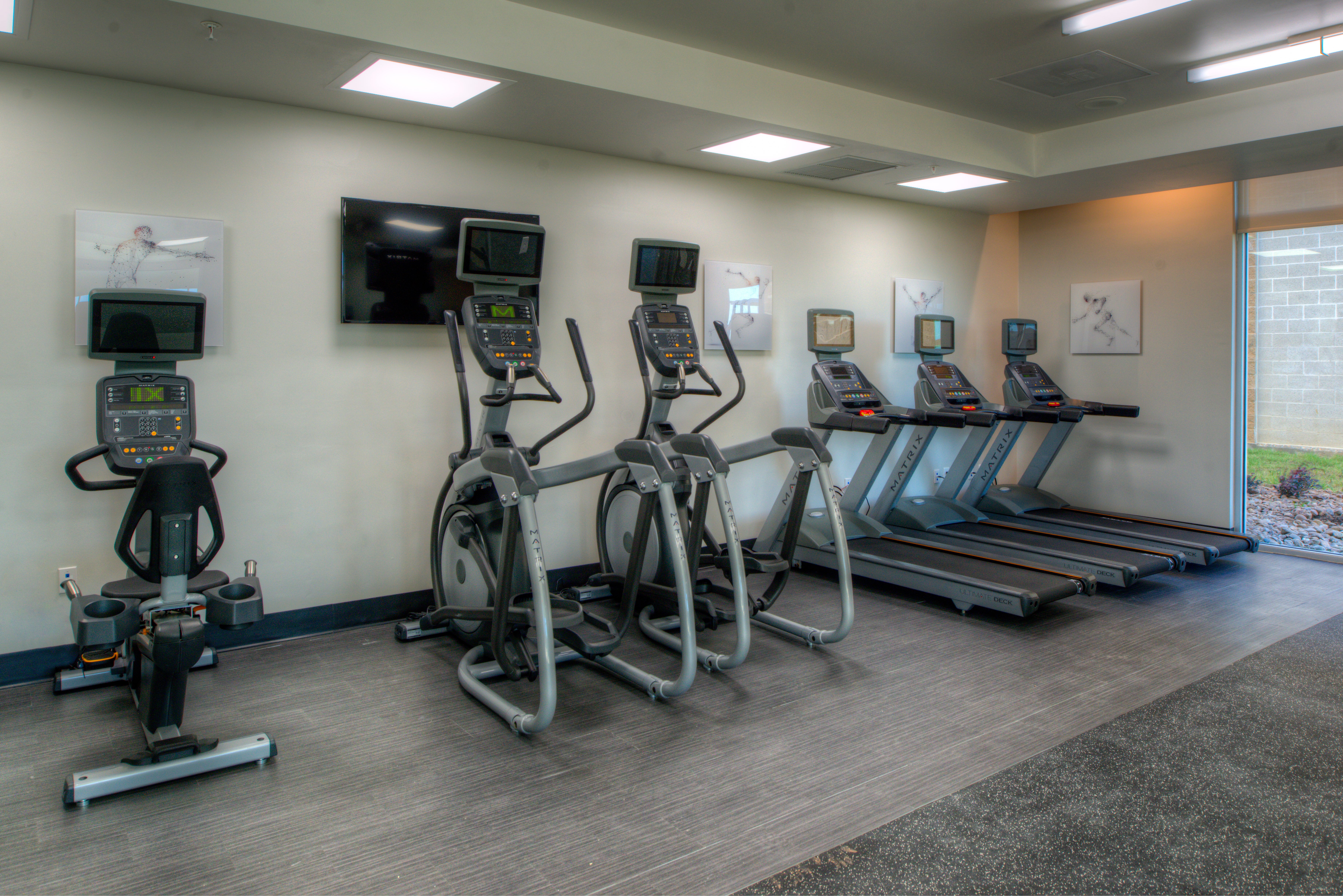 Maintain a workout routine at hotel fitness center on 1st floor
