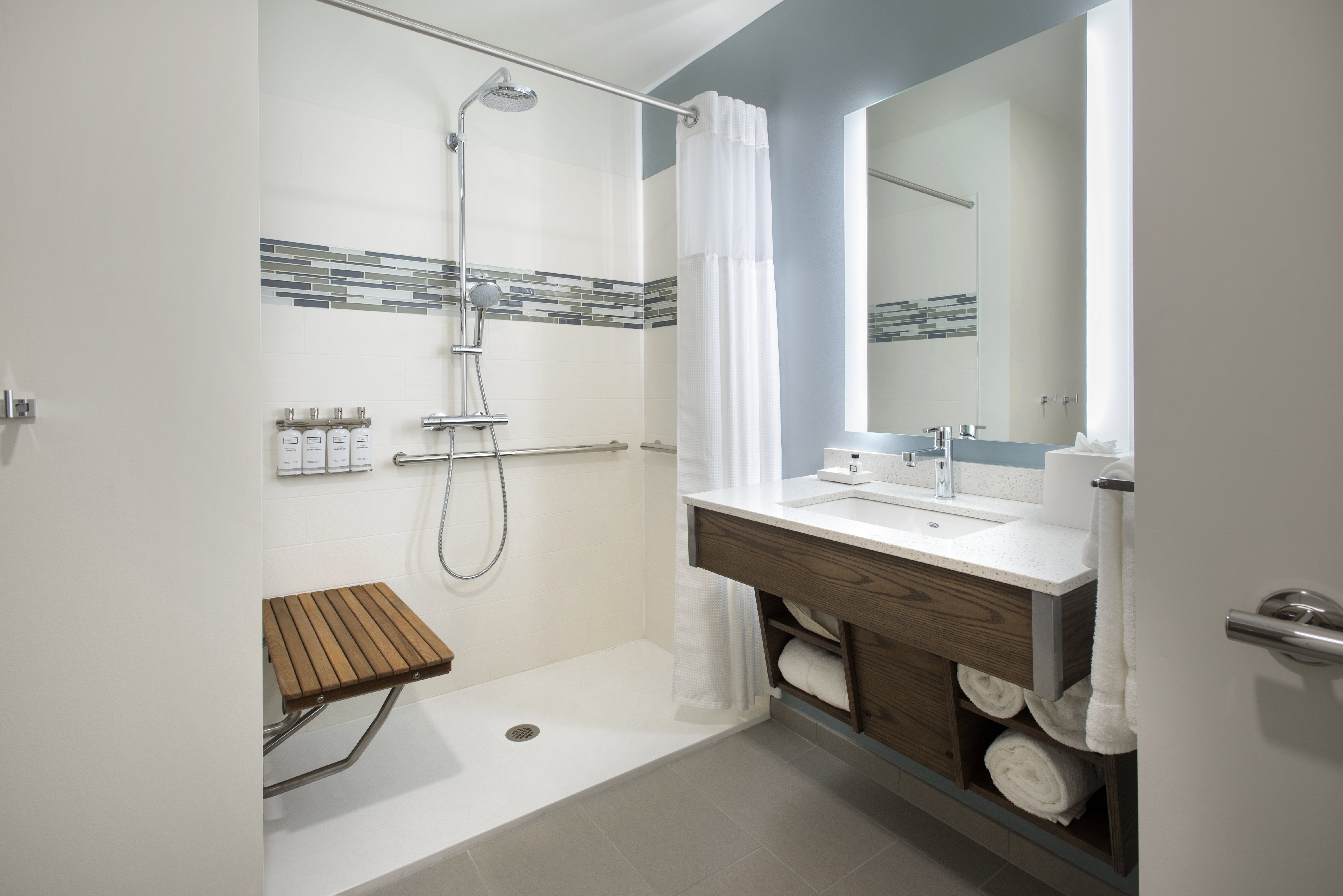 Our mobility accessible features include a roll-in shower.