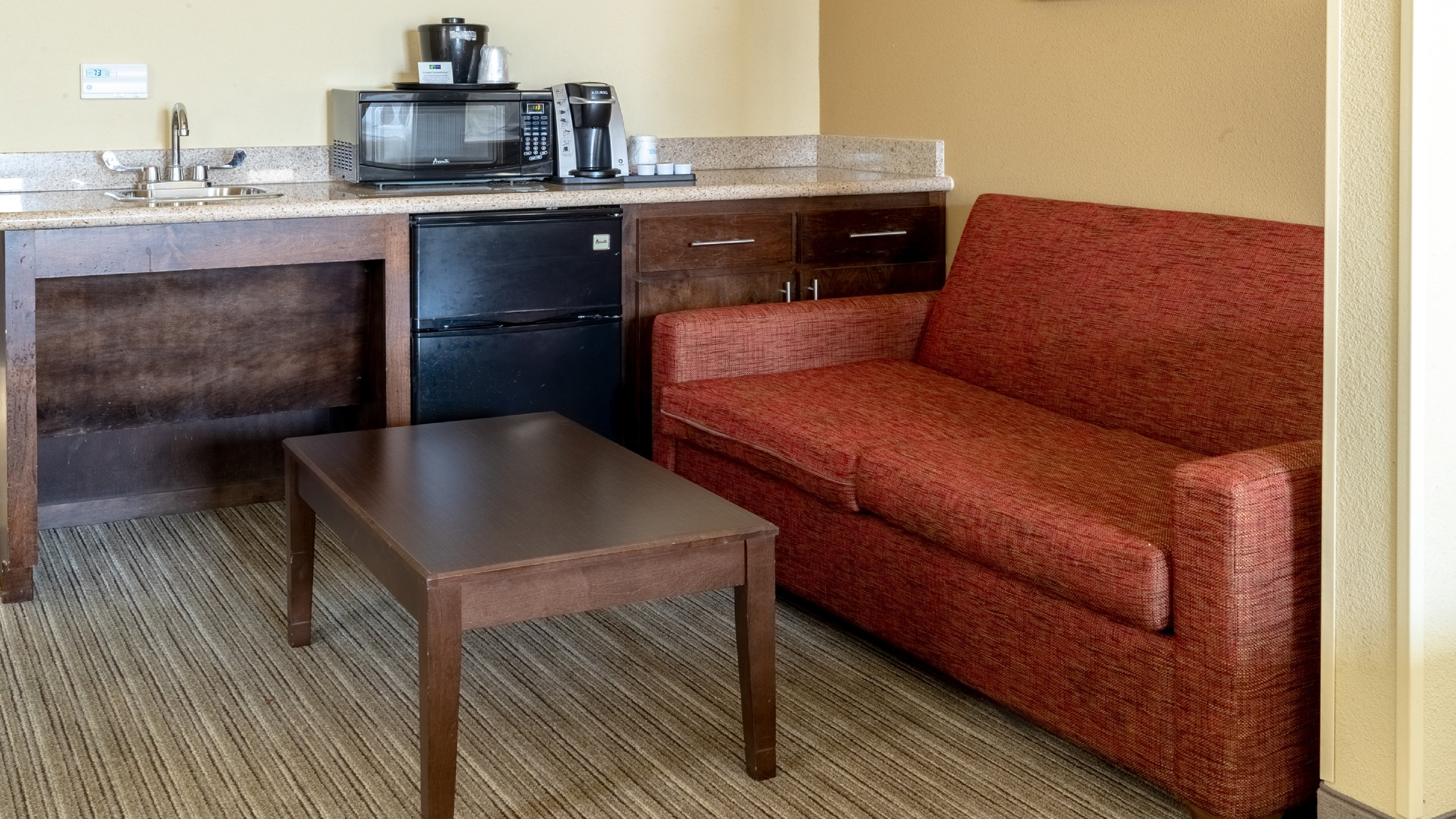 HOLIDAY INN EXP STES HOU PEARL BY I-guestroom-Sleeper Sofa.jpg