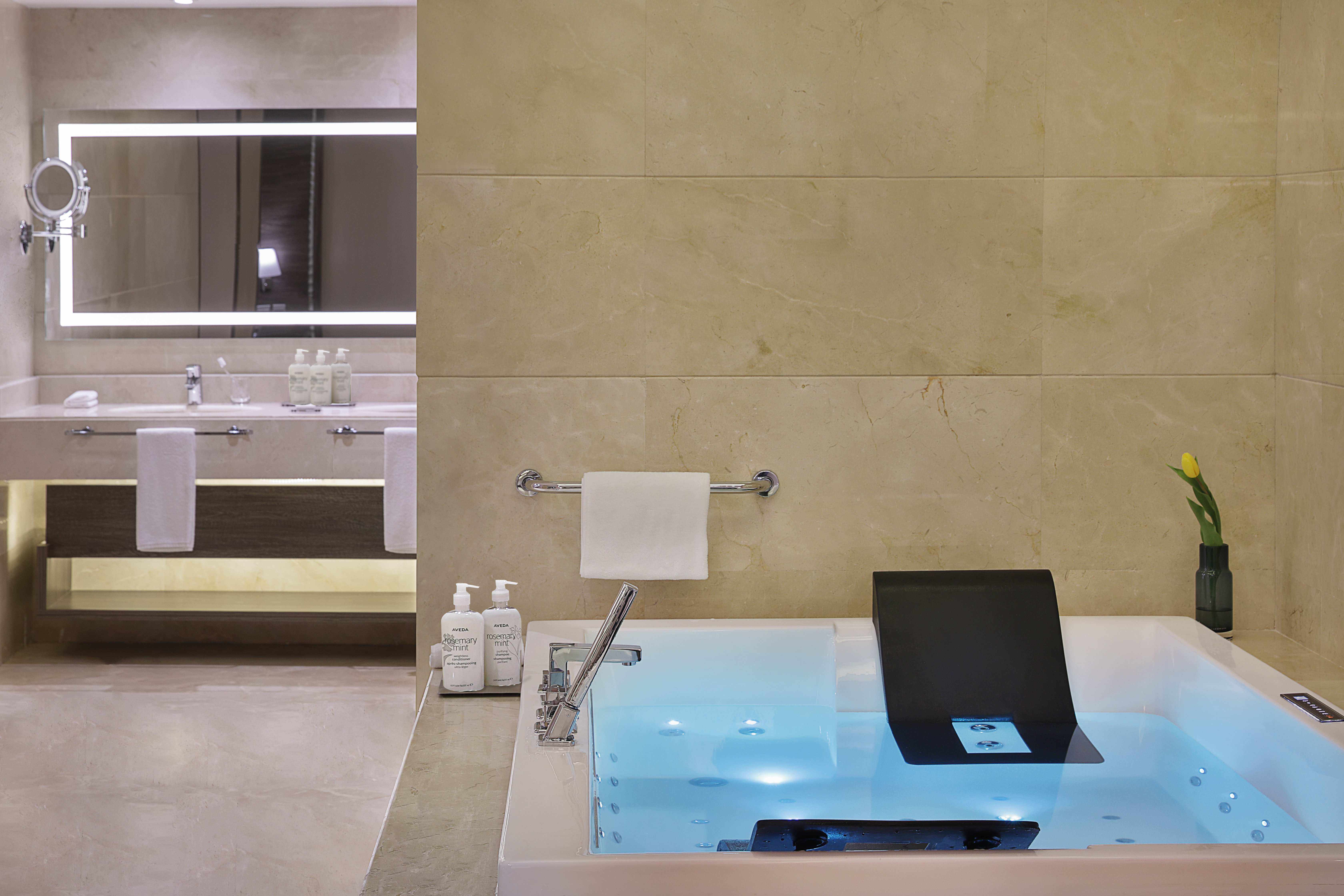VOCO AL KHOBAR BY IHG-guestroom-Bathroom with jacuzzi, Stillworks amenities, walk-in rain shower.jpg