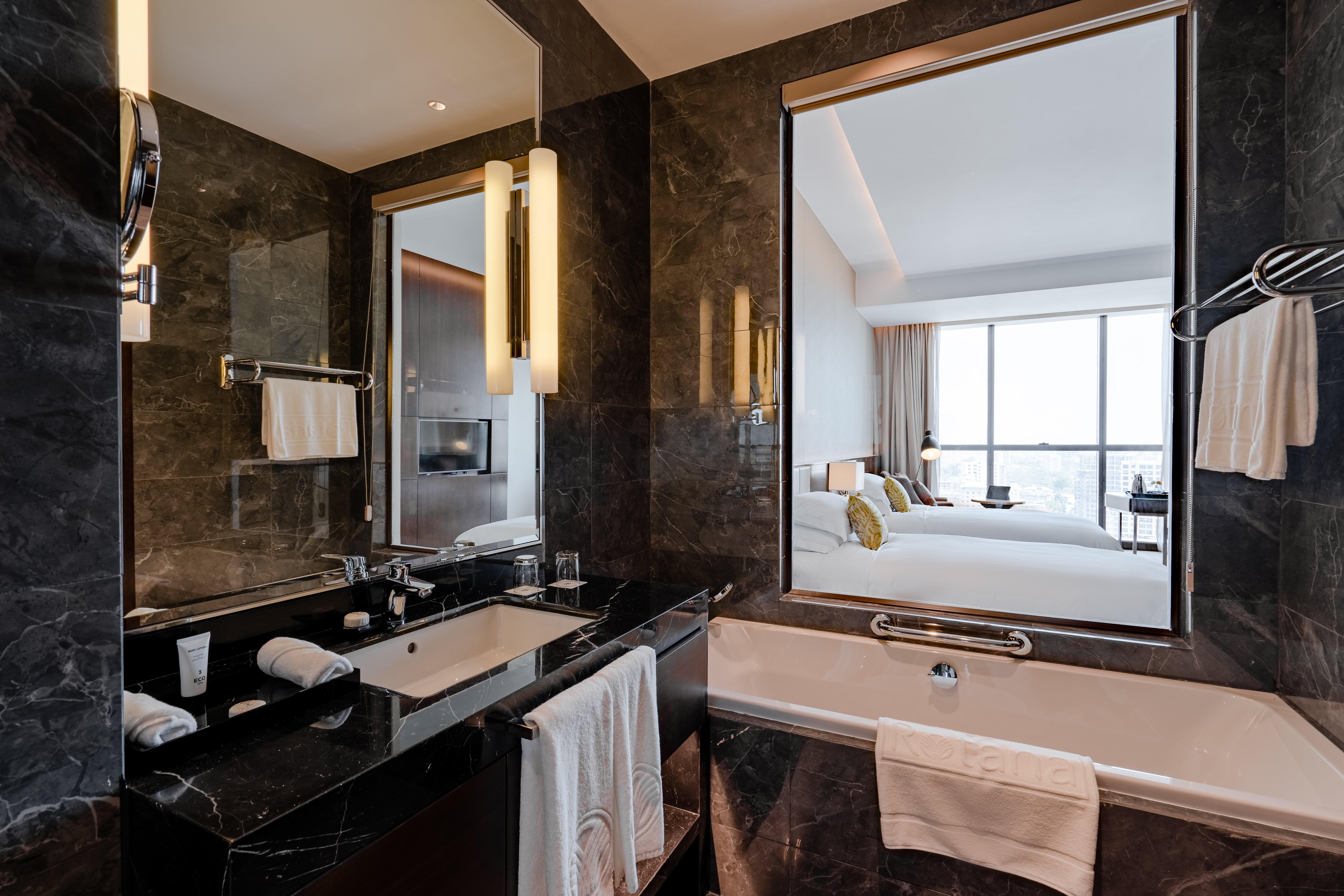 Johari Rotana-guestroom-Classic Room Twin Bathroom.jpg
