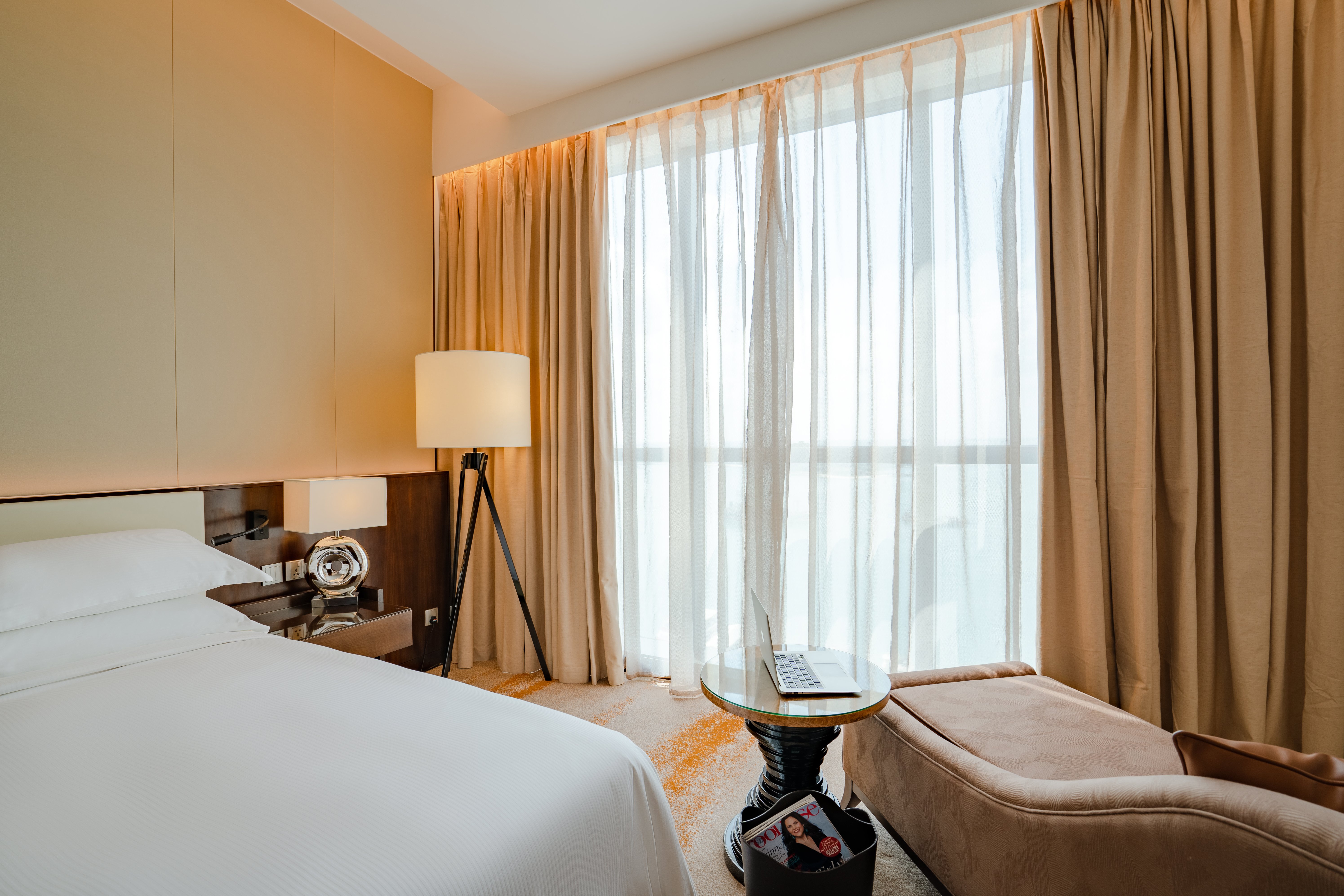 Johari Rotana-guestroom-Deluxe Suite Bedroom.jpg