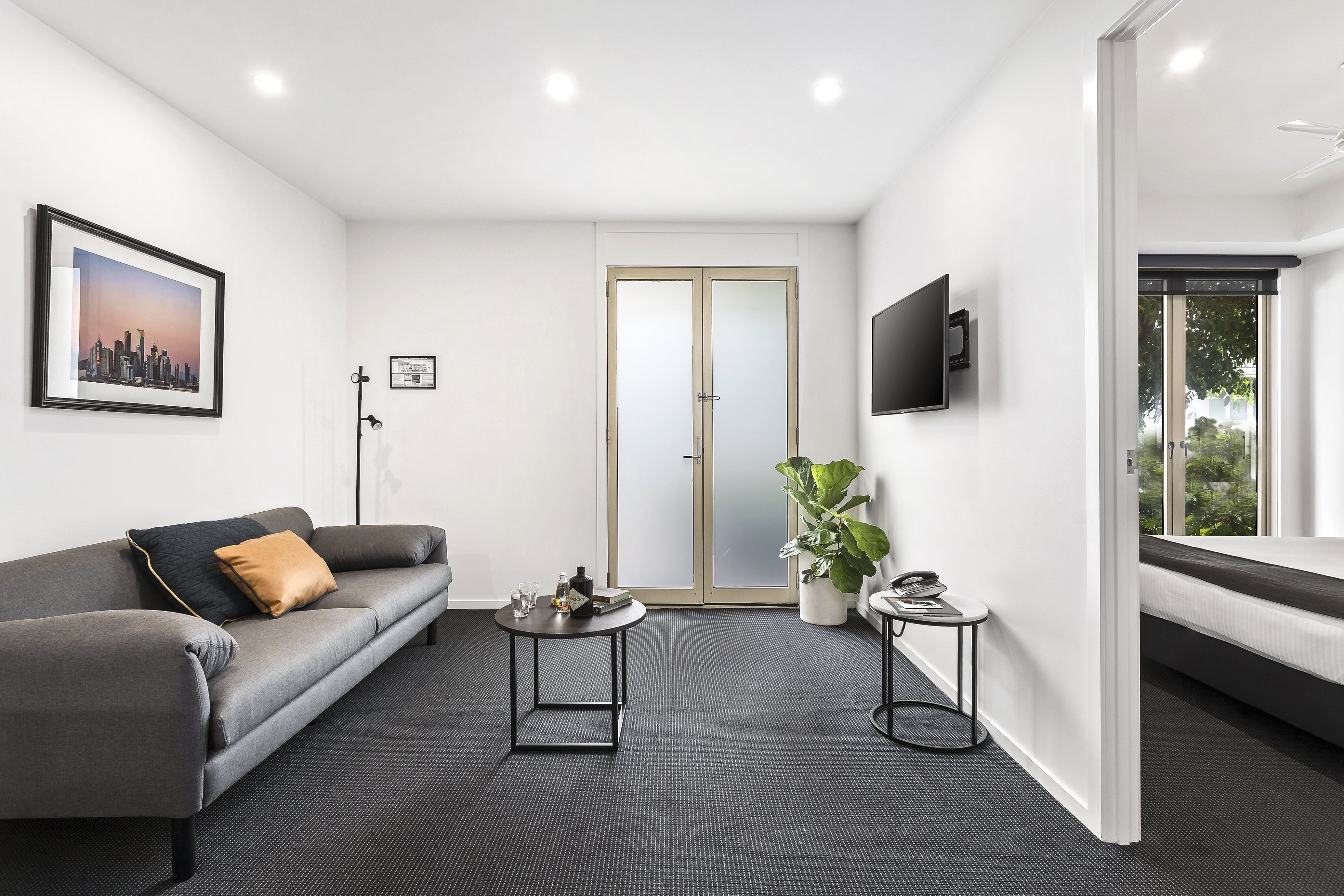 QUEST PRAHRAN-guestroom-One Bedroom Apartment Living Room.jpg