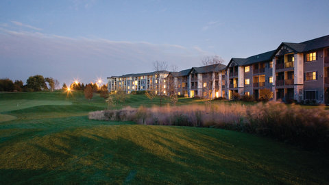 Exterior view of property building at dusk.