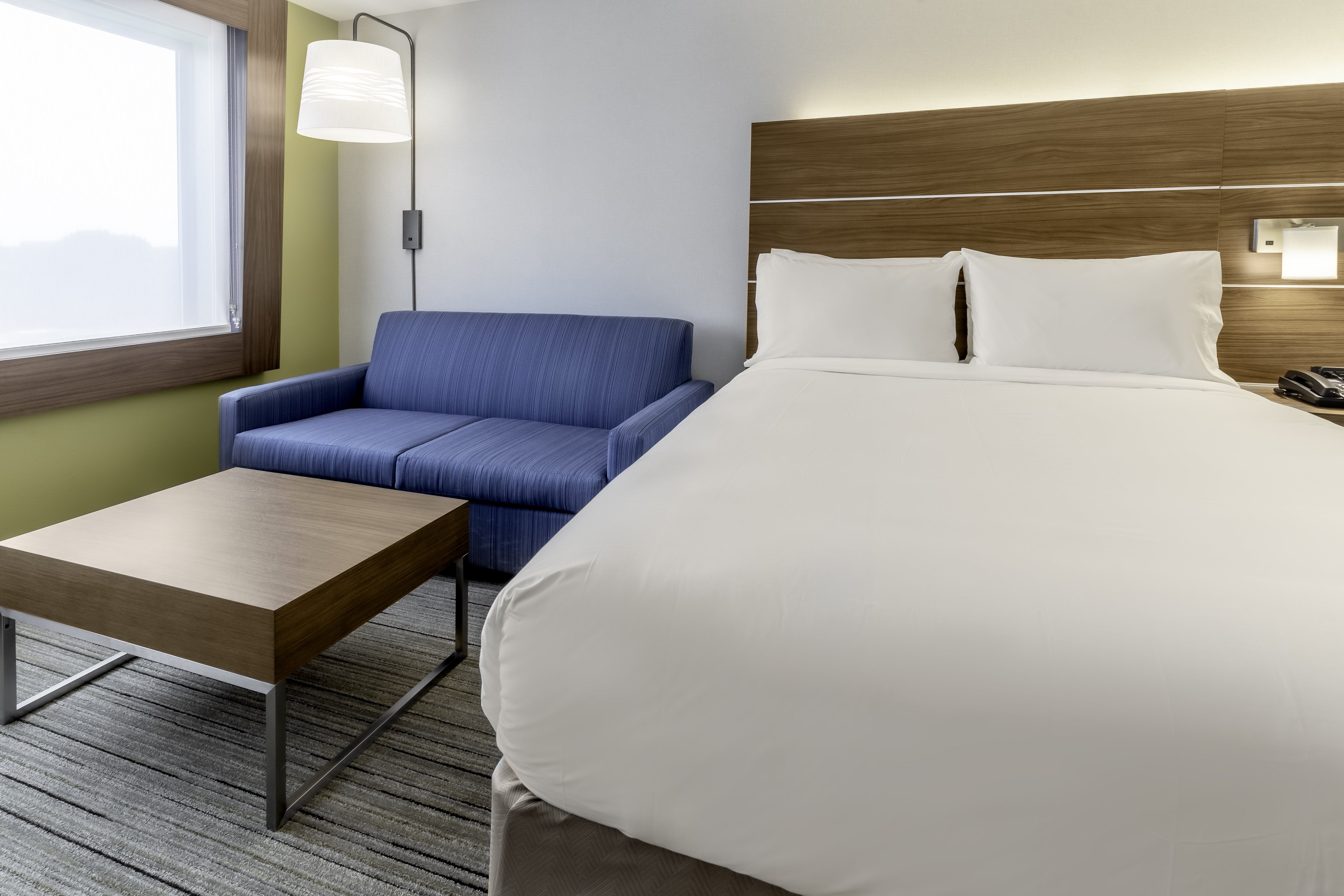 HOLIDAY INN EXP STES WEST ALLIS BY-guestroom-Queen Bedroom Suites provide ample room for work and rest.jpg