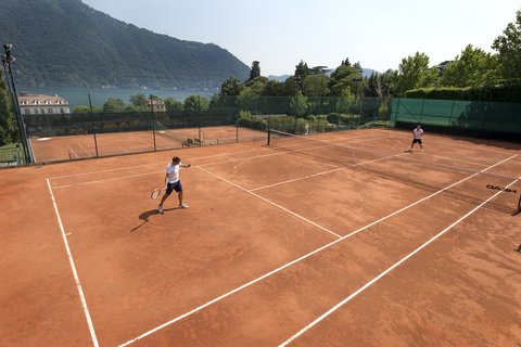 Tennis courts with lake view with 2 tennis players.jpg