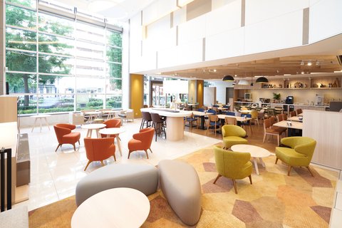 Sun-filled high-ceiling lobby welcomes you.