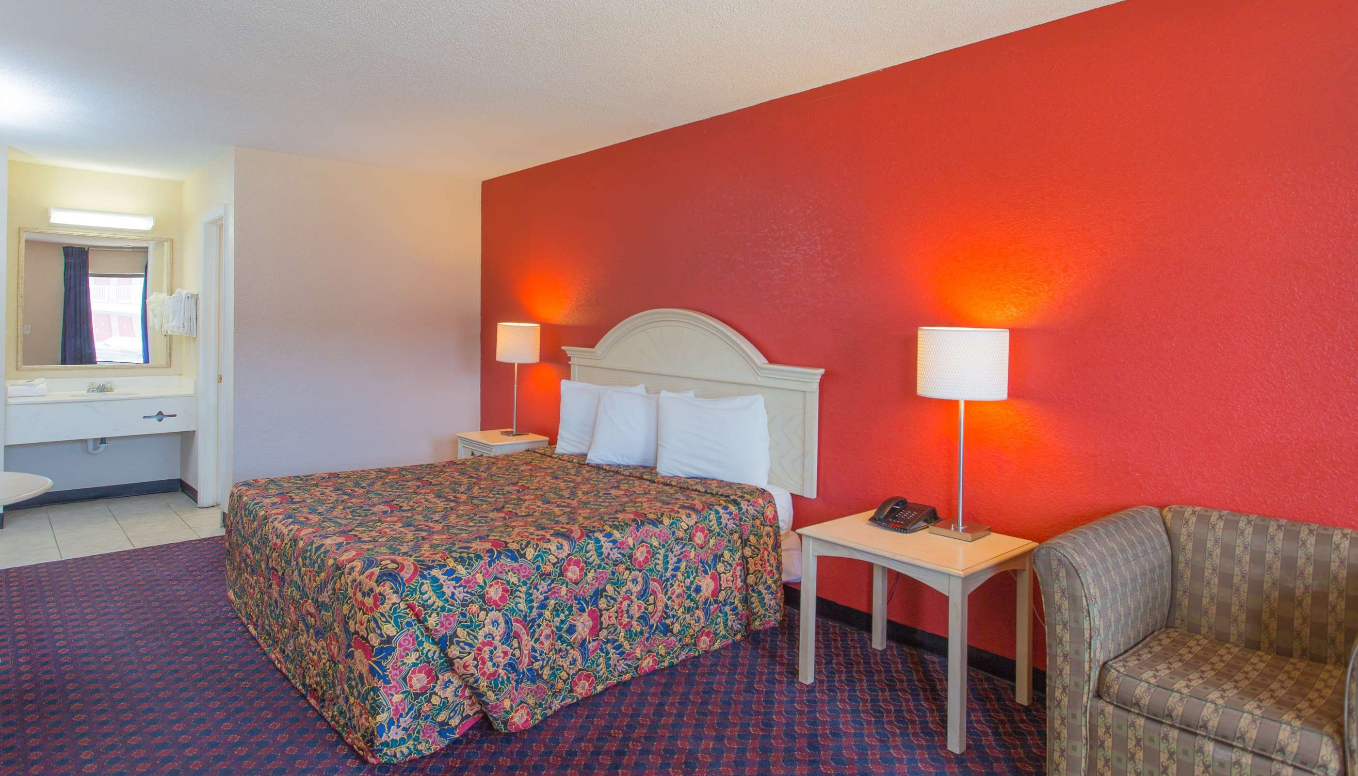 Studios and Suites 4 Less Batt-guestroom-King Bed.jpg