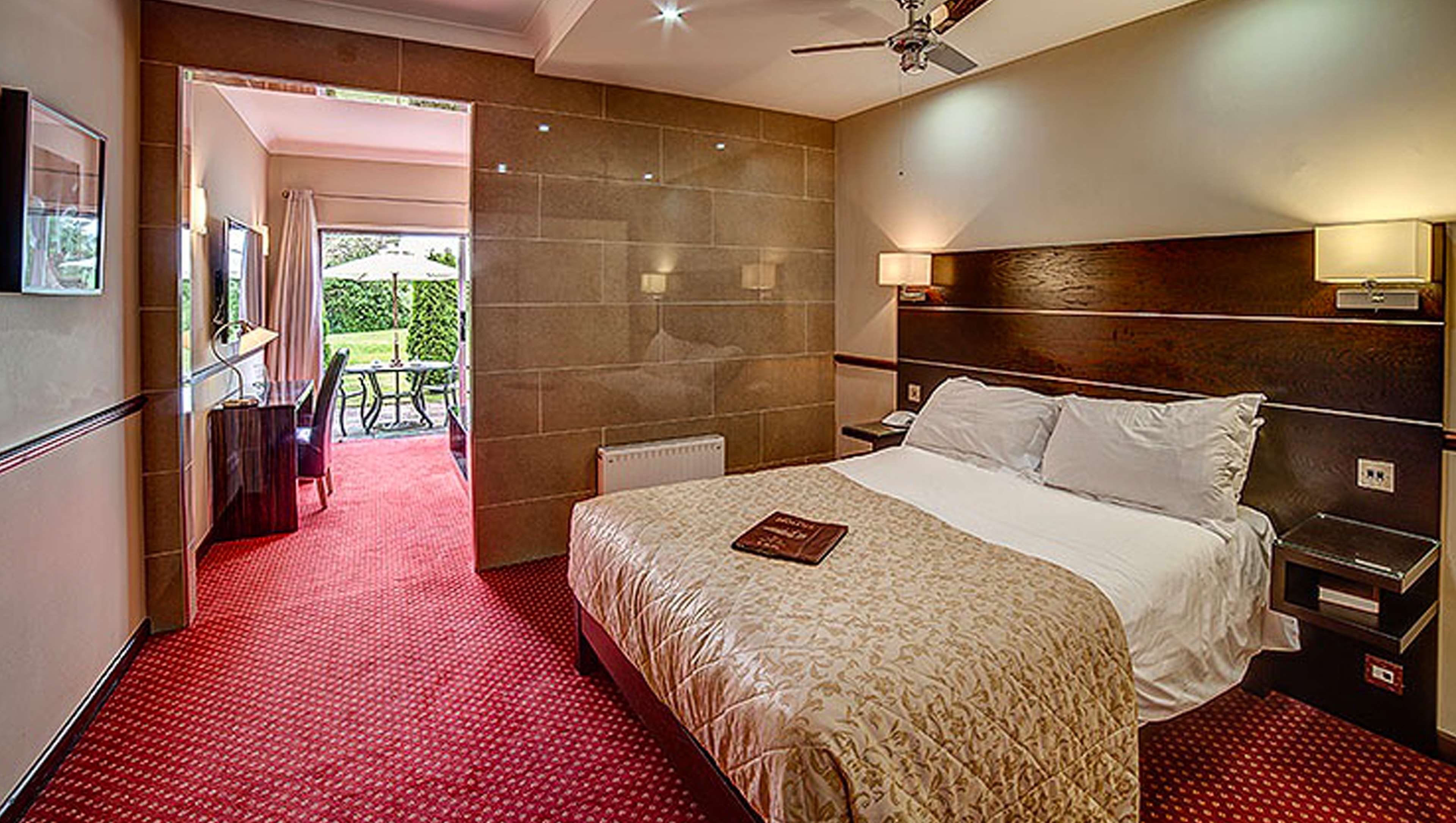 The Hollies Hotel-guestroom-MH TheHolliesHotel Surrey UK Guestroom JuniorSuite.jpg