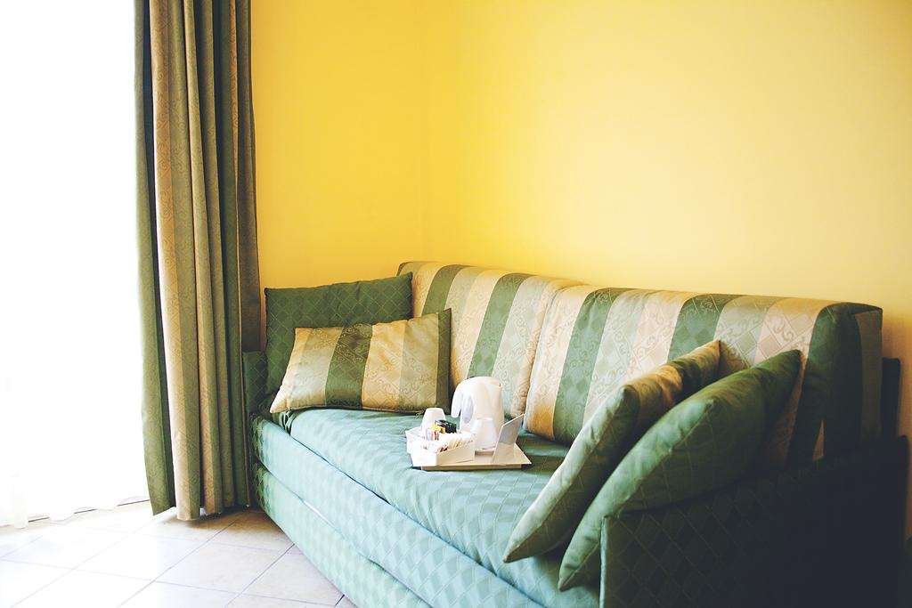 HOTEL PRESTIGE - MONTESILVANO-guestroom-GUEST ROOM SOFA.jpg