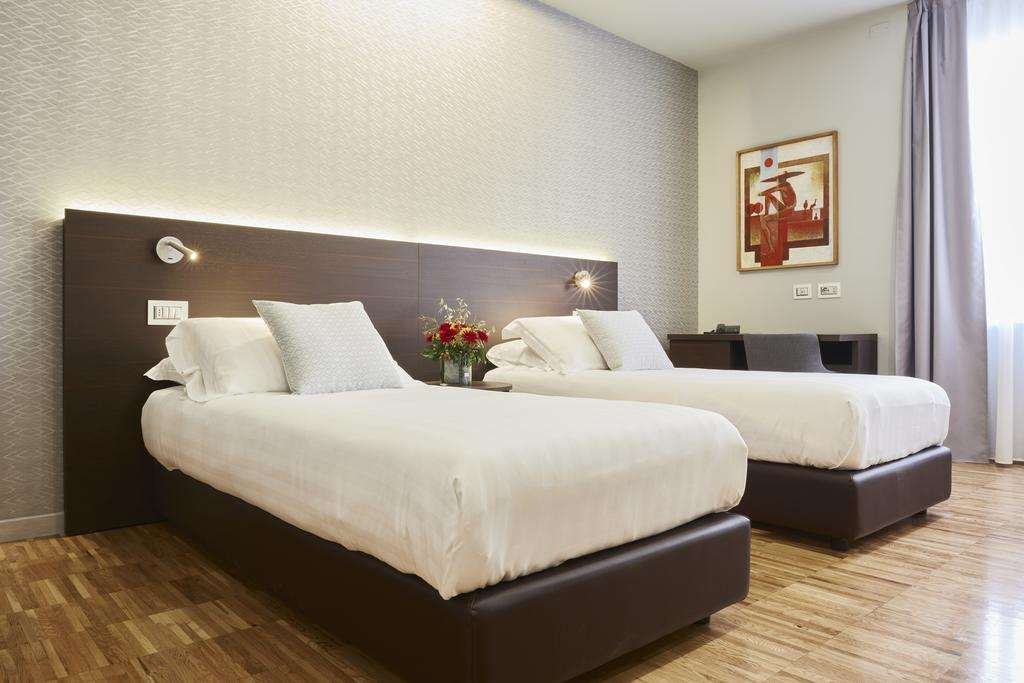 HOTEL MICHELANGELO CARRARA-guestroom-GUEST ROOM.jpg