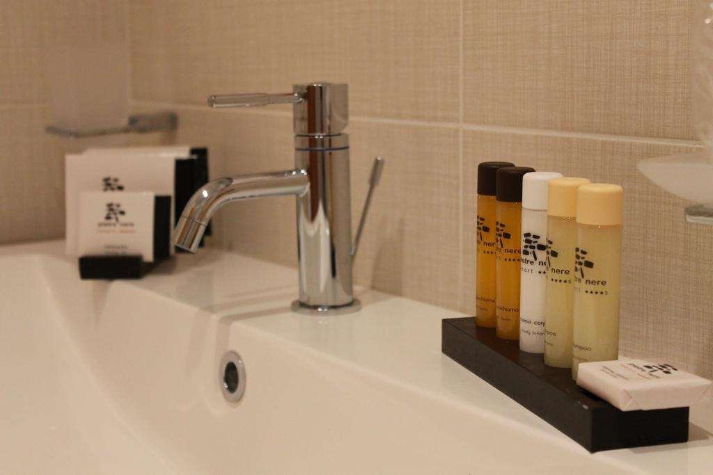 PIETRE NERE RESORT - MODICA-guestroom-BATHROOM AMENITIES.jpg