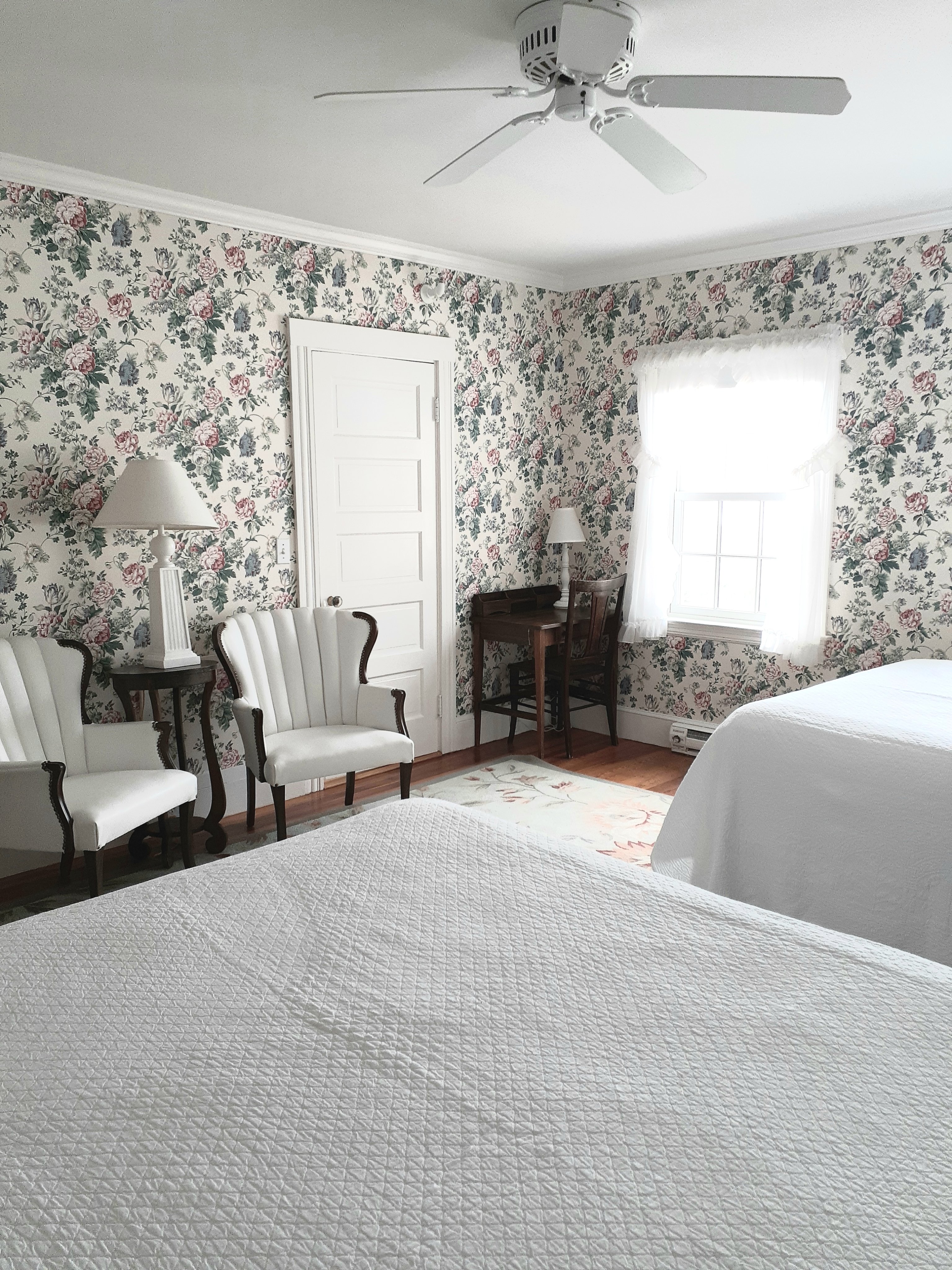 Large room with two queen beds and great windows.