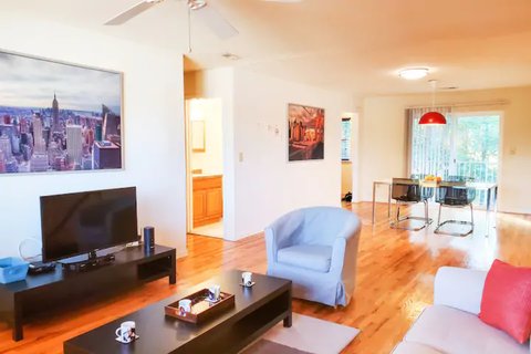 unny living room flows into the dining space adjoining the patio overlooking the golf course.