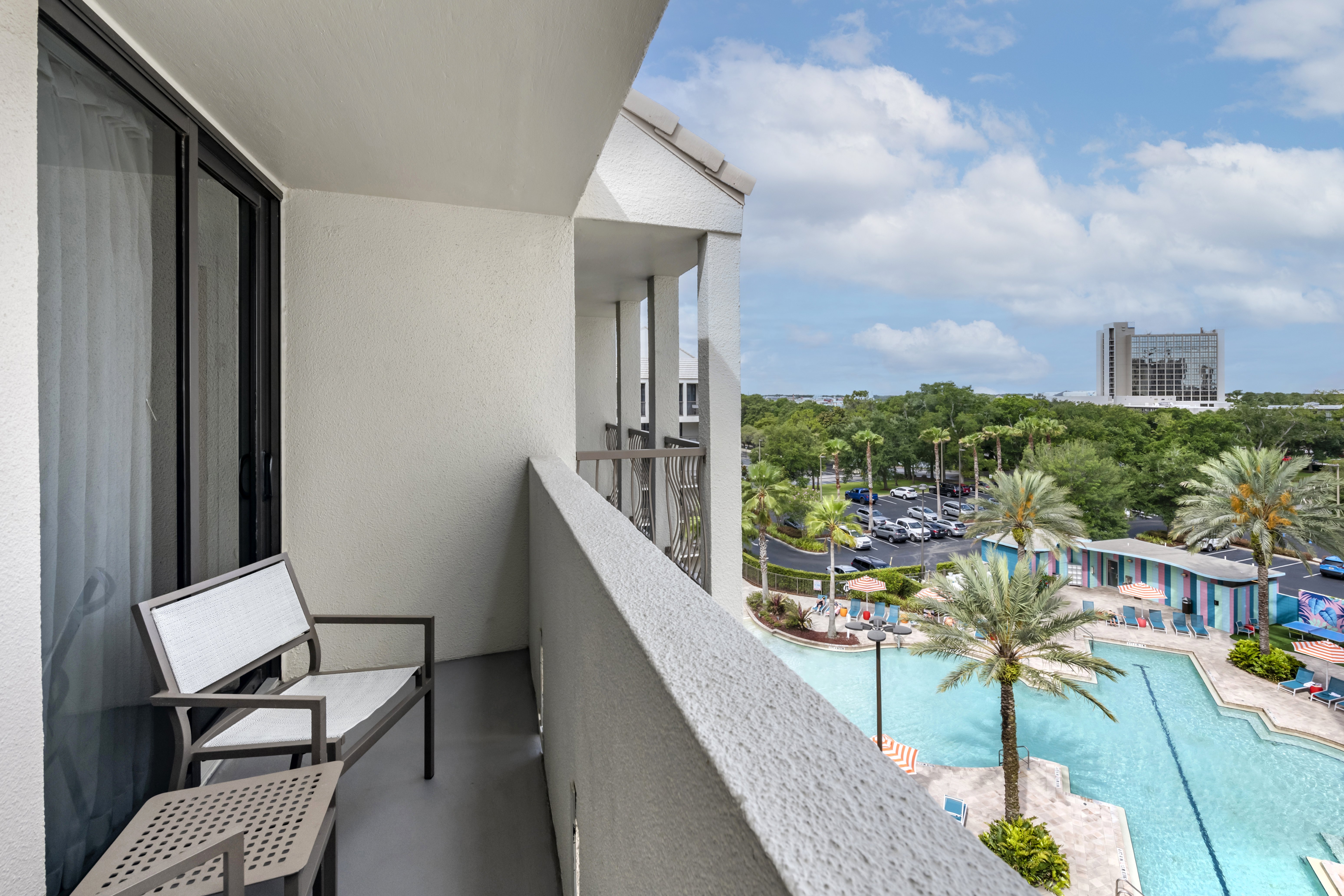 Sit back and relax on your balcony overlooking the pool