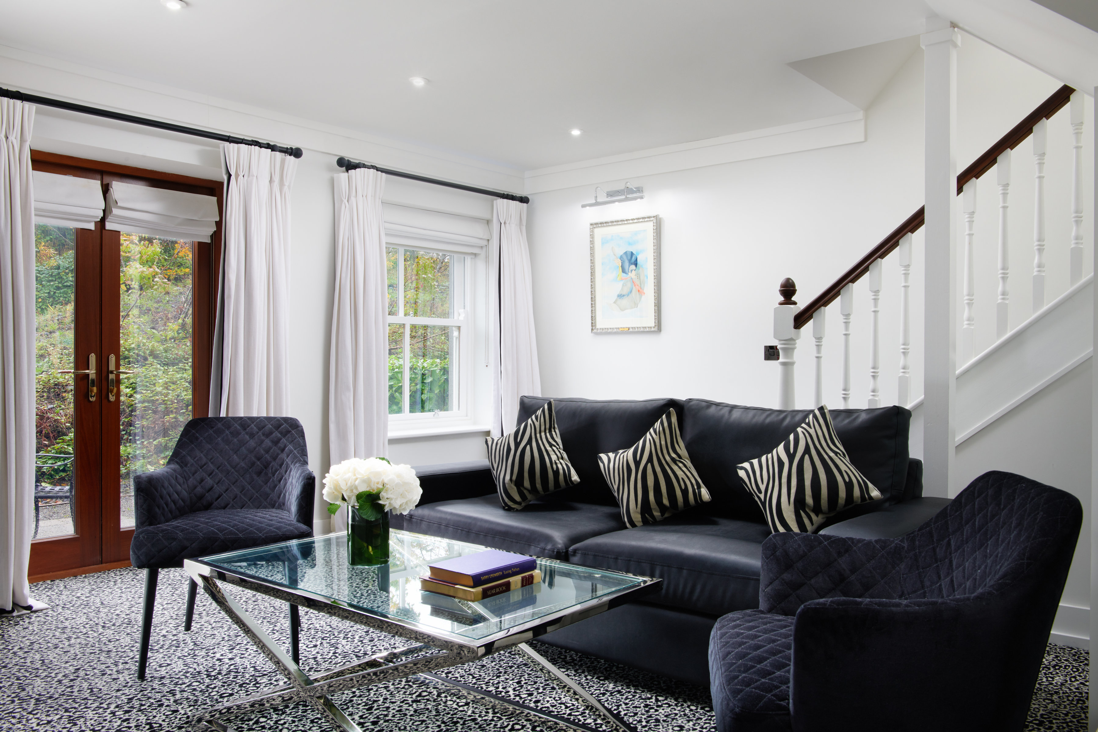 THE LODGE AT ASHFORD CASTLE-guestroom-Lodge At Ashford Castle Duplex Suite Lounge.jpg