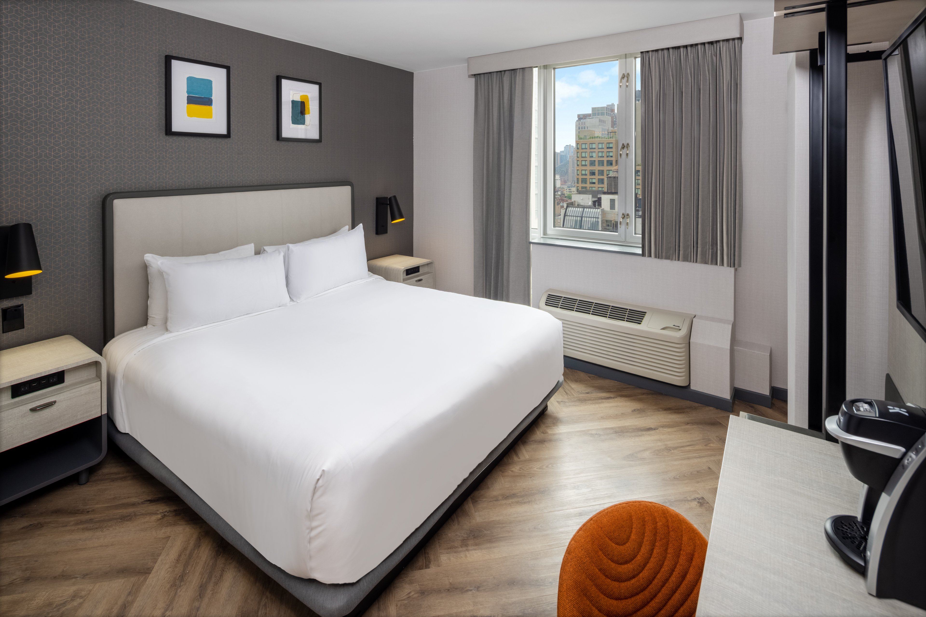 Premium king bed room with city views at our Times Square hotel.