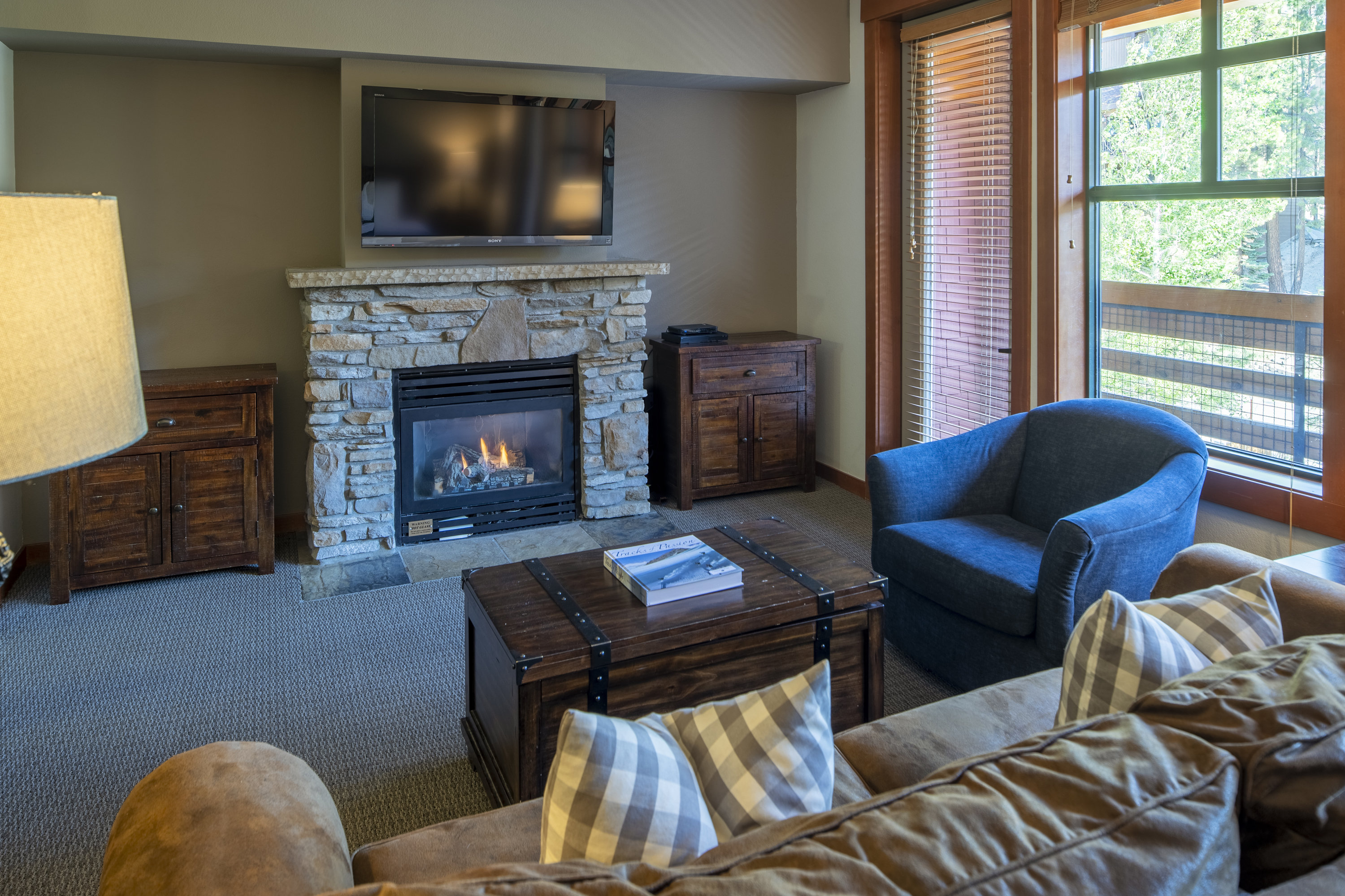 The Village Lodge Studio living area with gas fireplace