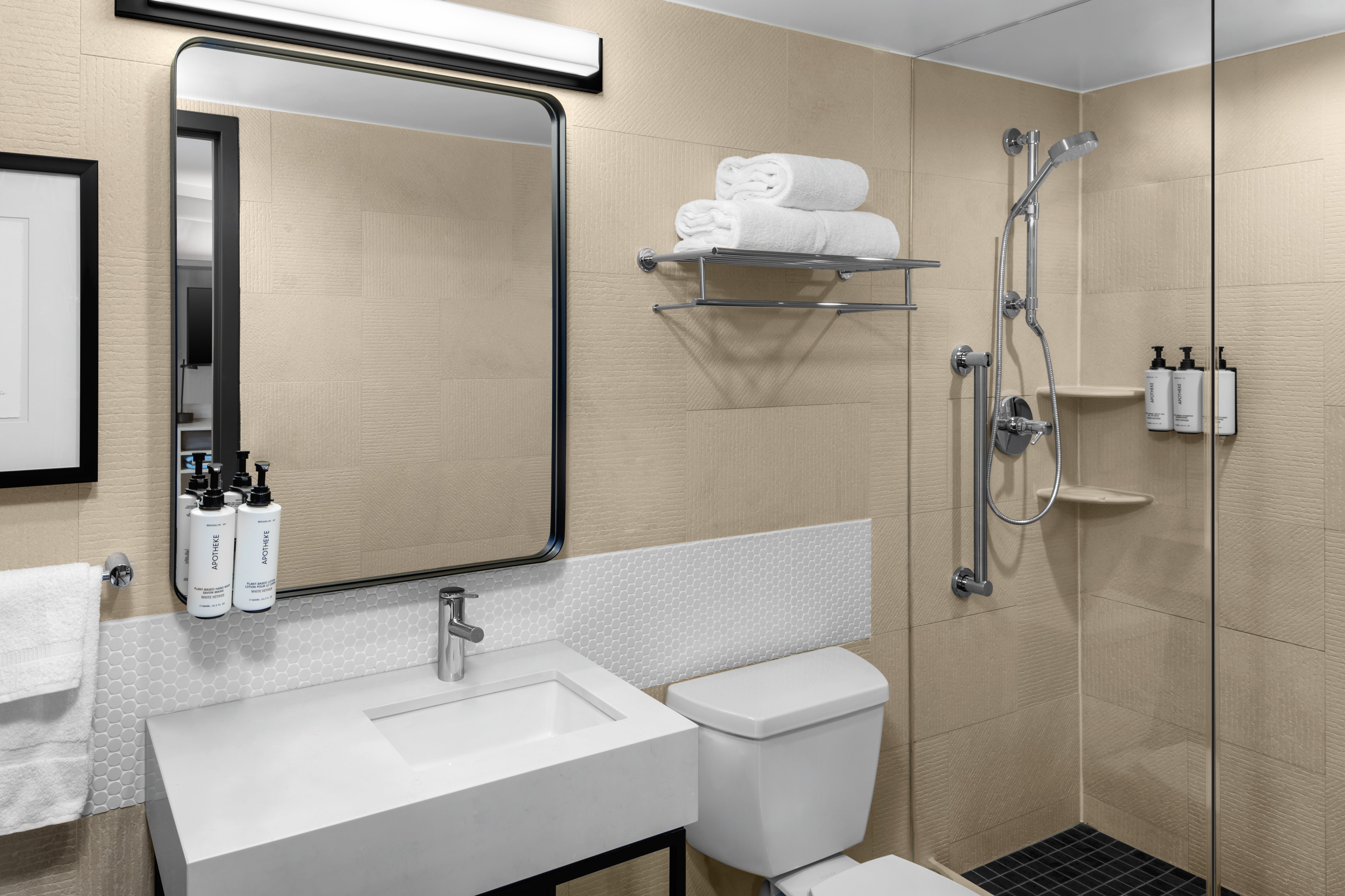 Guest baths feature Apotheke amenities & spa-inspired design.