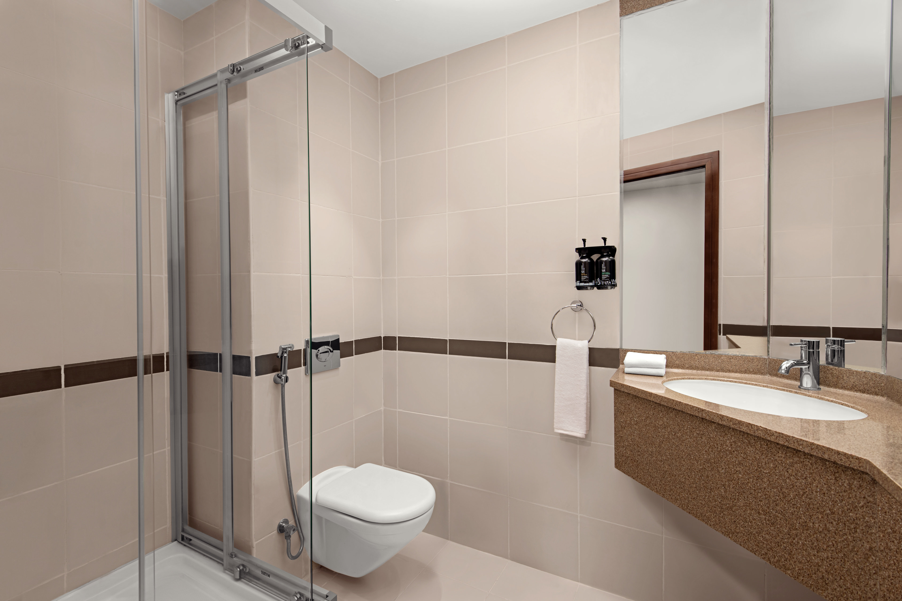 HOLIDAY INN EX DUBAI INTERNET BY IH-guestroom-Our bathroom includes all necessary amenities for a perfect stay.jpg