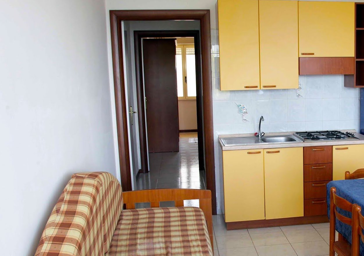 TROPEA MARE PACE CLUB-guestroom-LIVING ROOM.jpg