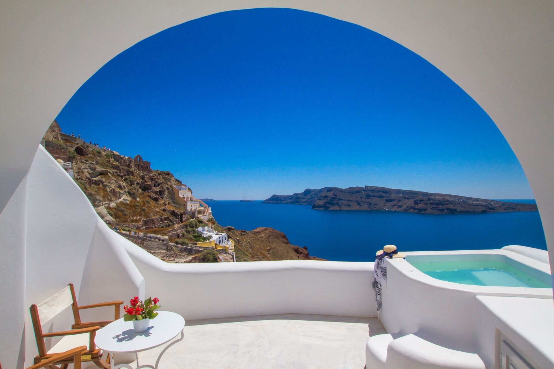 OIA MARE VILLAS-guestroom-Honeymoon Cave Suite Hot Tub.jpg