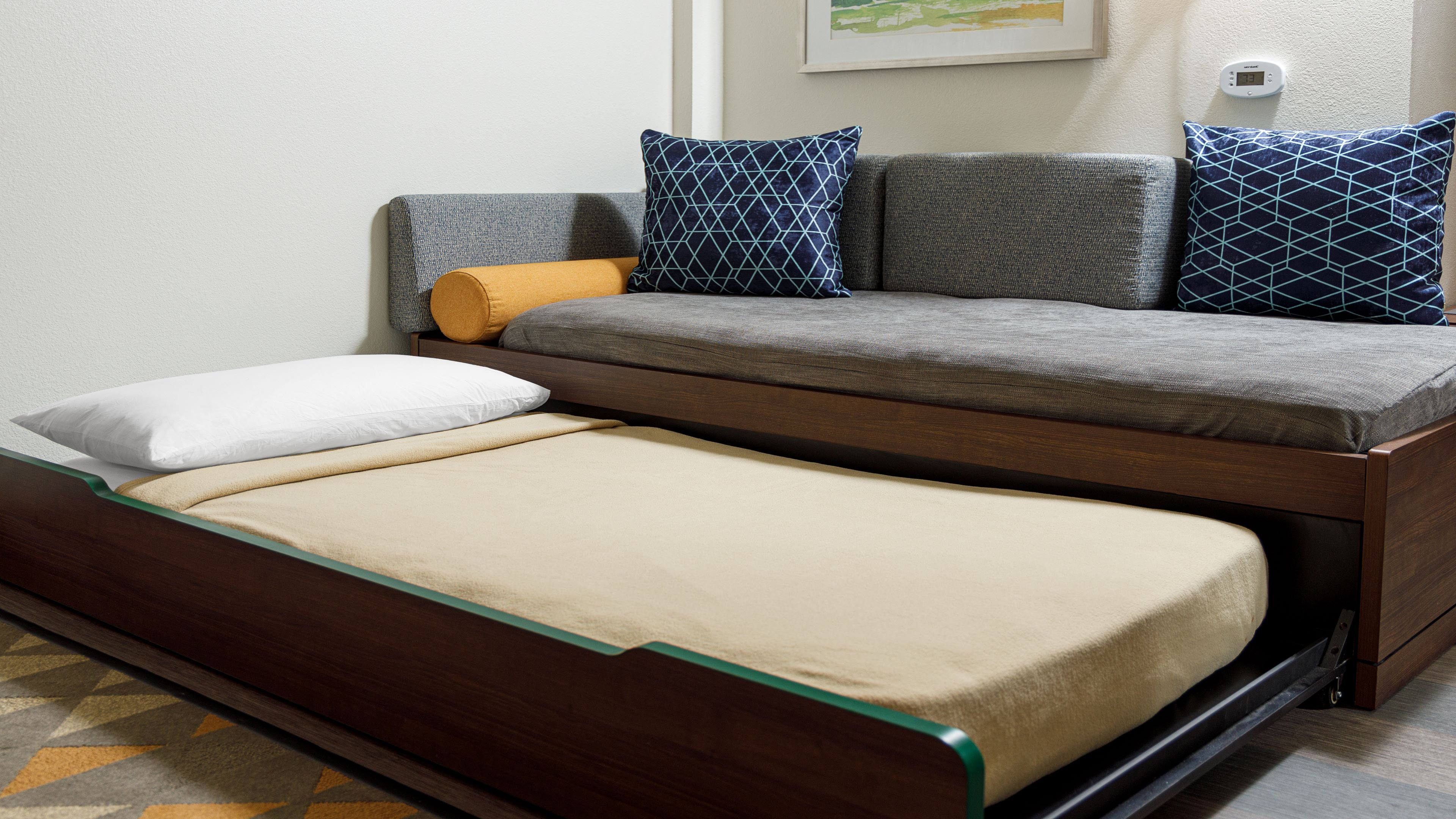 A trundle bed gives you extra sleeping space!