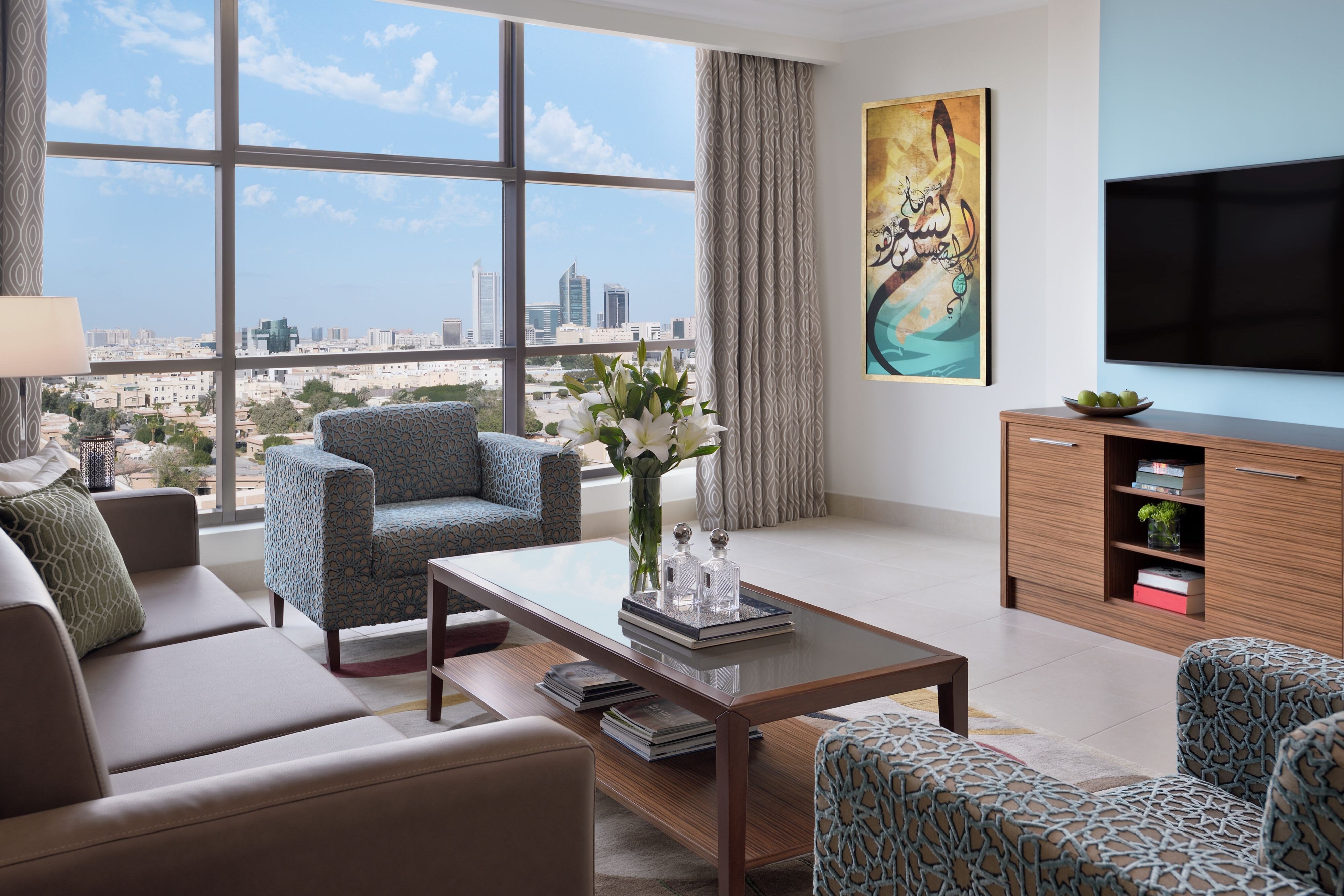 Marriott Executive Apartments Al Khobar-guestroom-Living area with city view.jpg