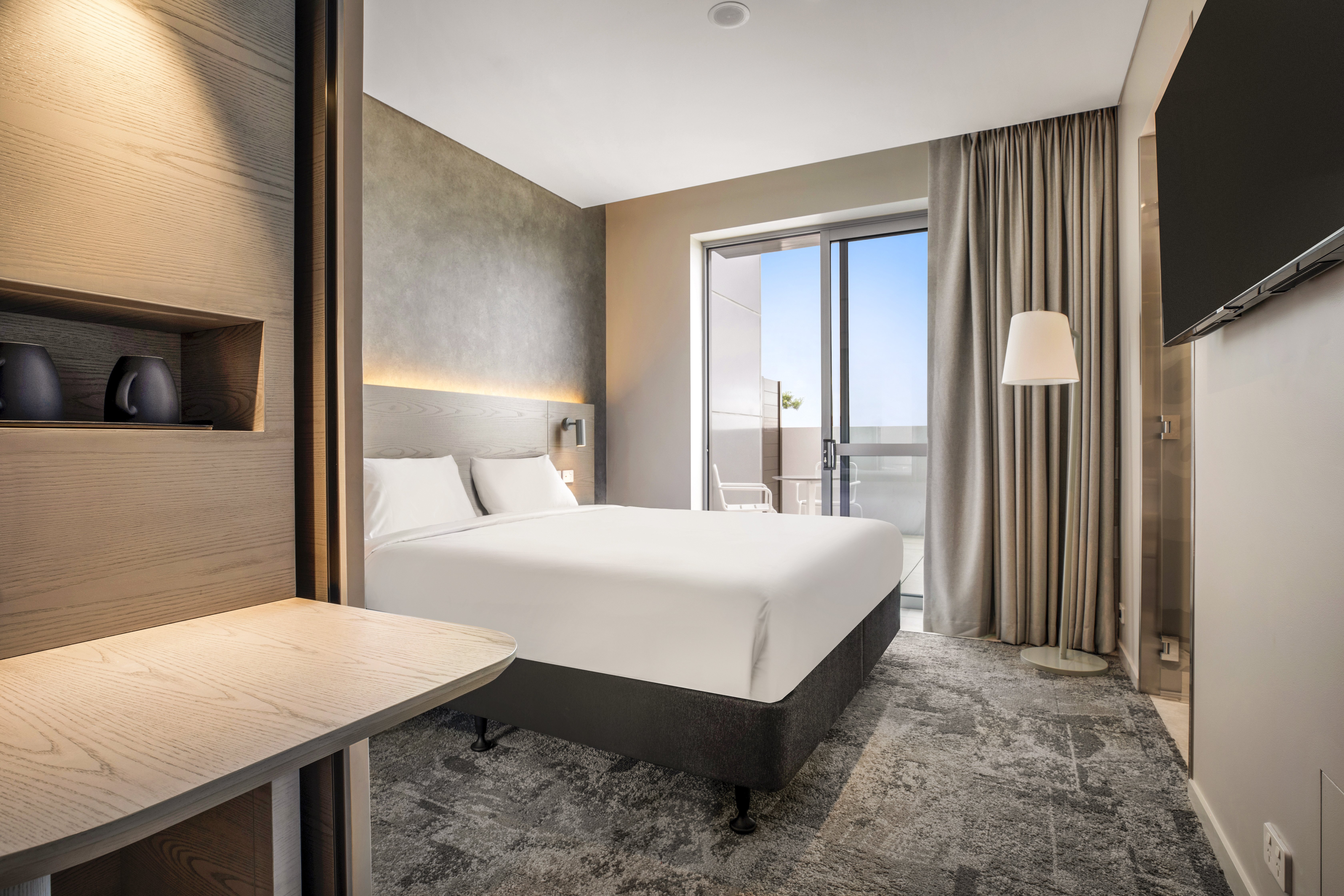 HOLIDAY INN EXP STES SUNSHINE COAST-guestroom-1 King Bed Suite with Patio.jpg