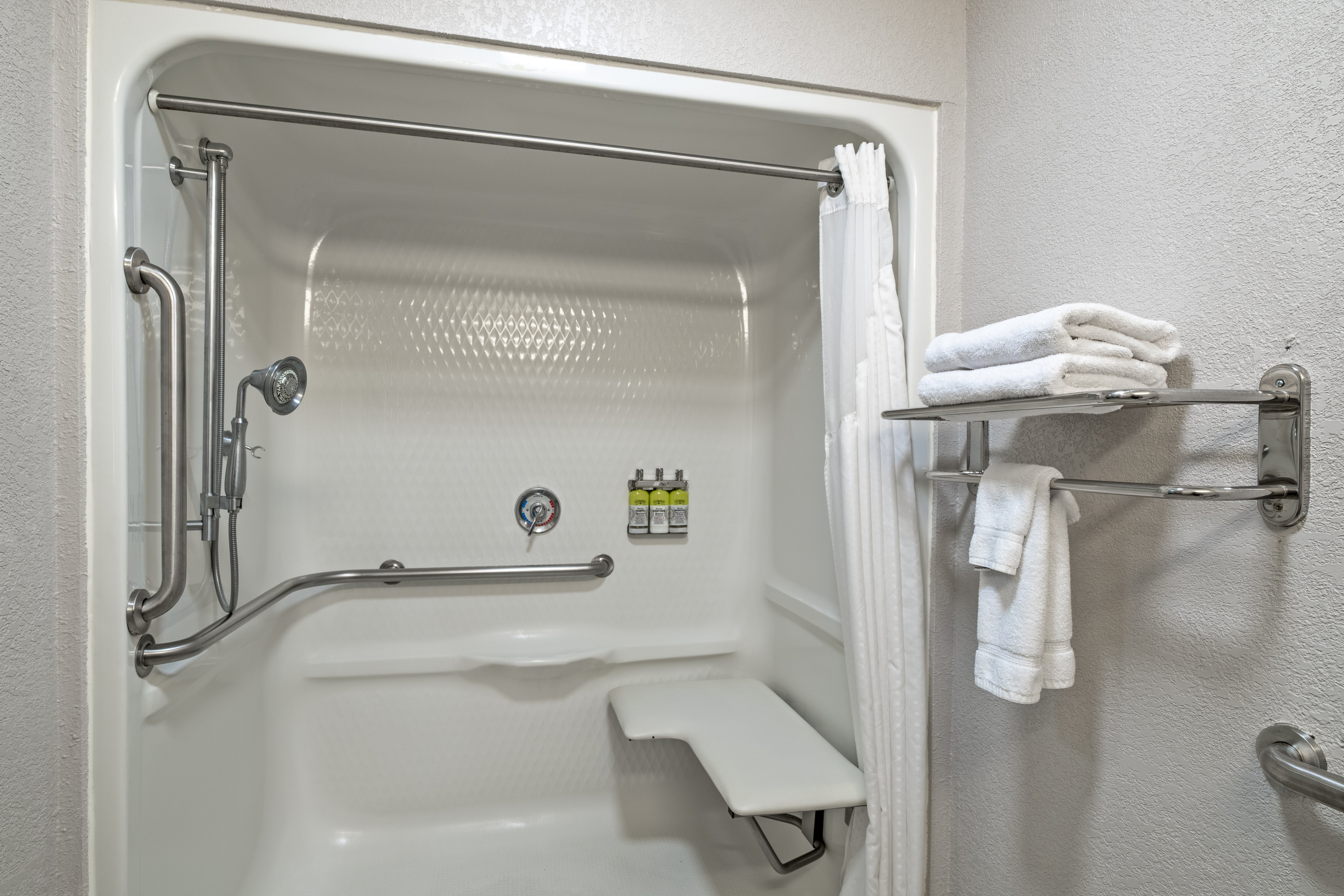HOLIDAY INN EXP STES WOODBRIDG BY I-guestroom-Handicap Accessible Bathroom with Roll-In Shower.jpg