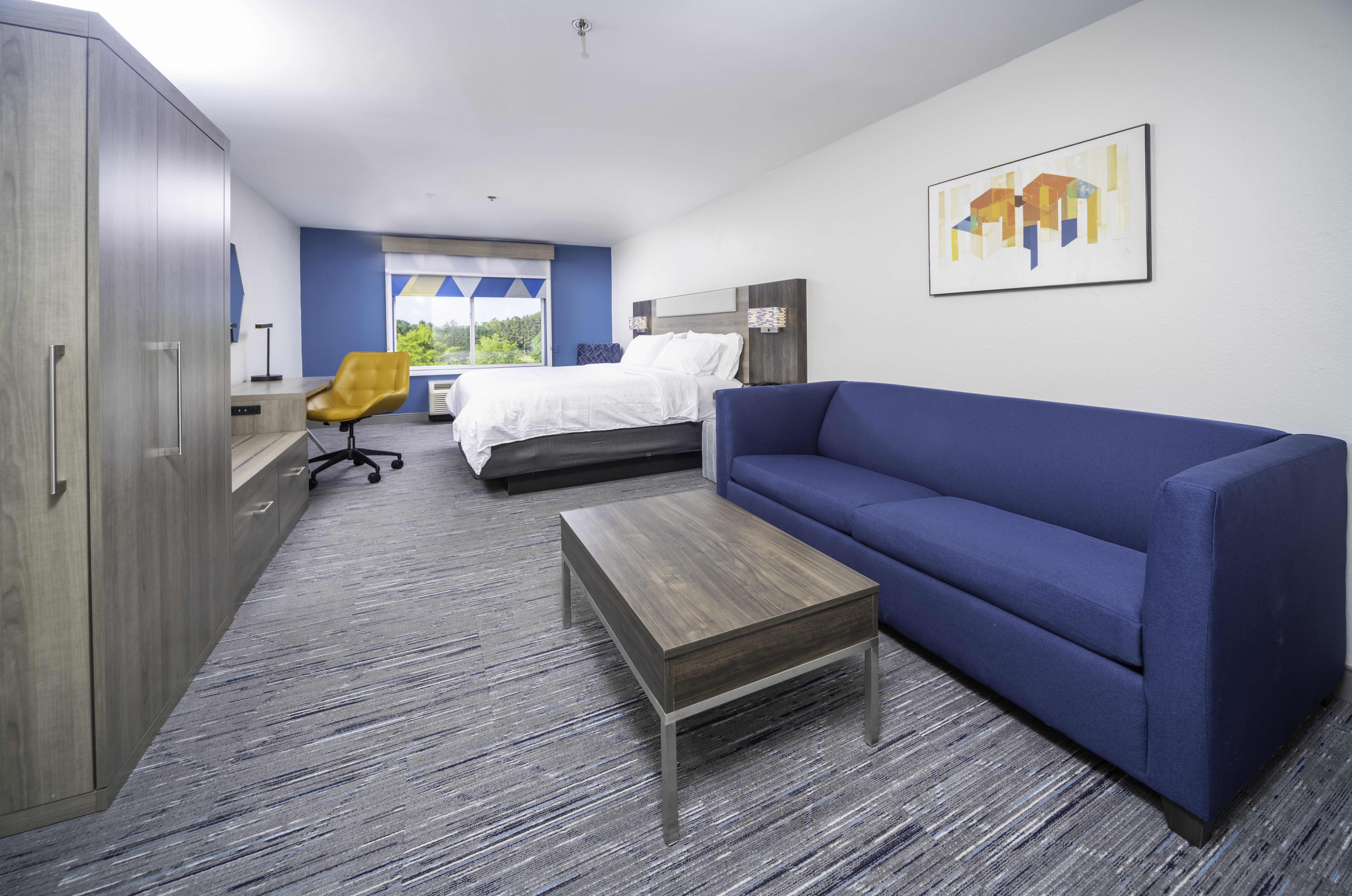 HOLIDAY INN EXP STES JOHN CREEK BY-guestroom-King Suite is the perfect room for business travelers or family .jpg