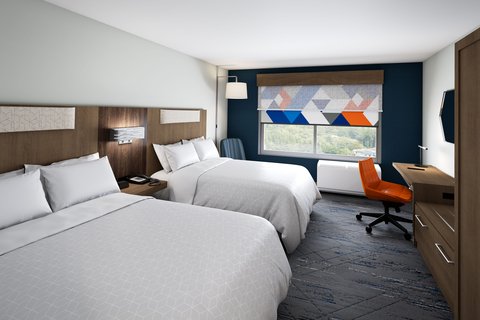 Rest easy in a bright guest room with space to unwind.
