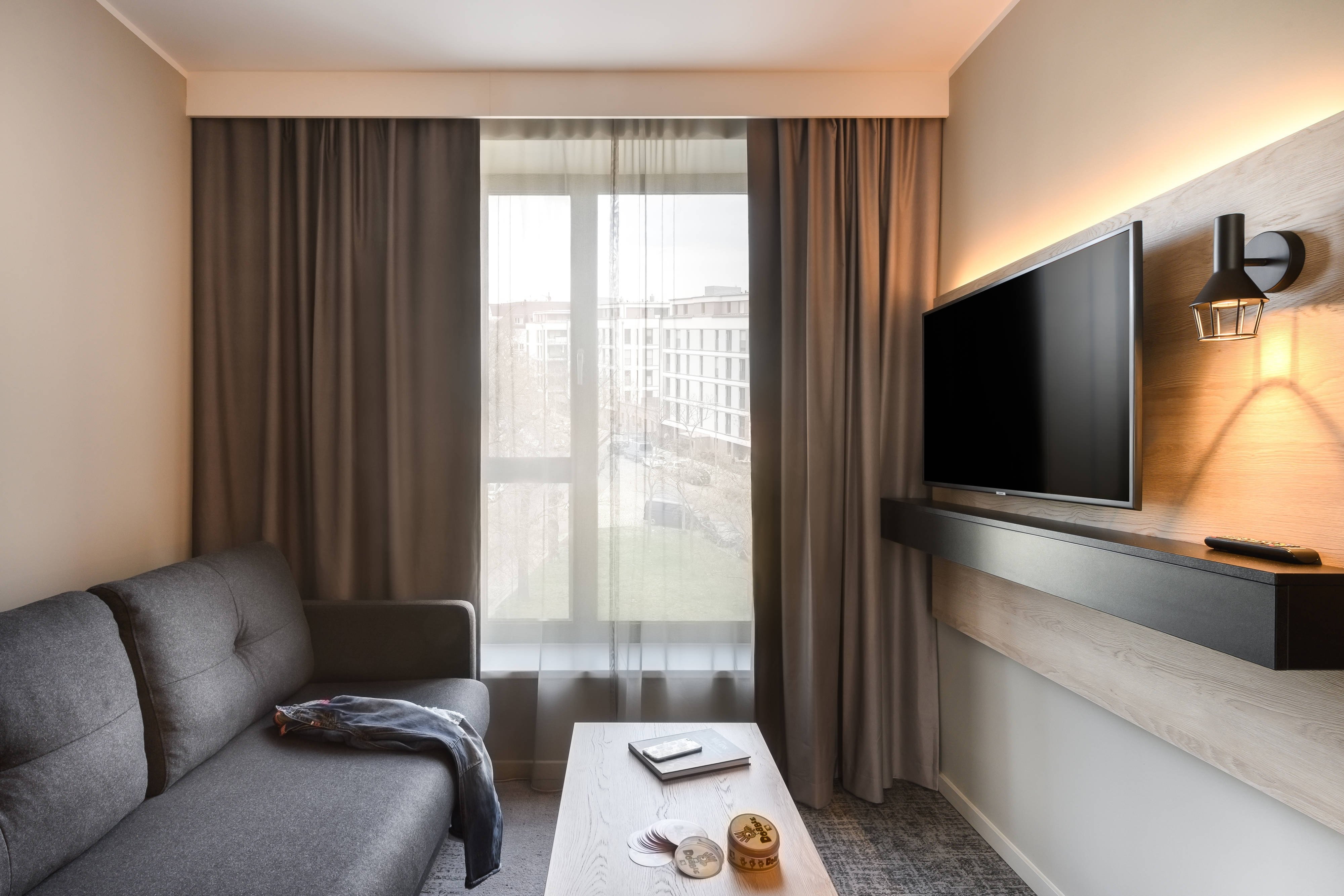 Moxy Dresden Neustadt-guestroom-Family Room Living Area.jpg
