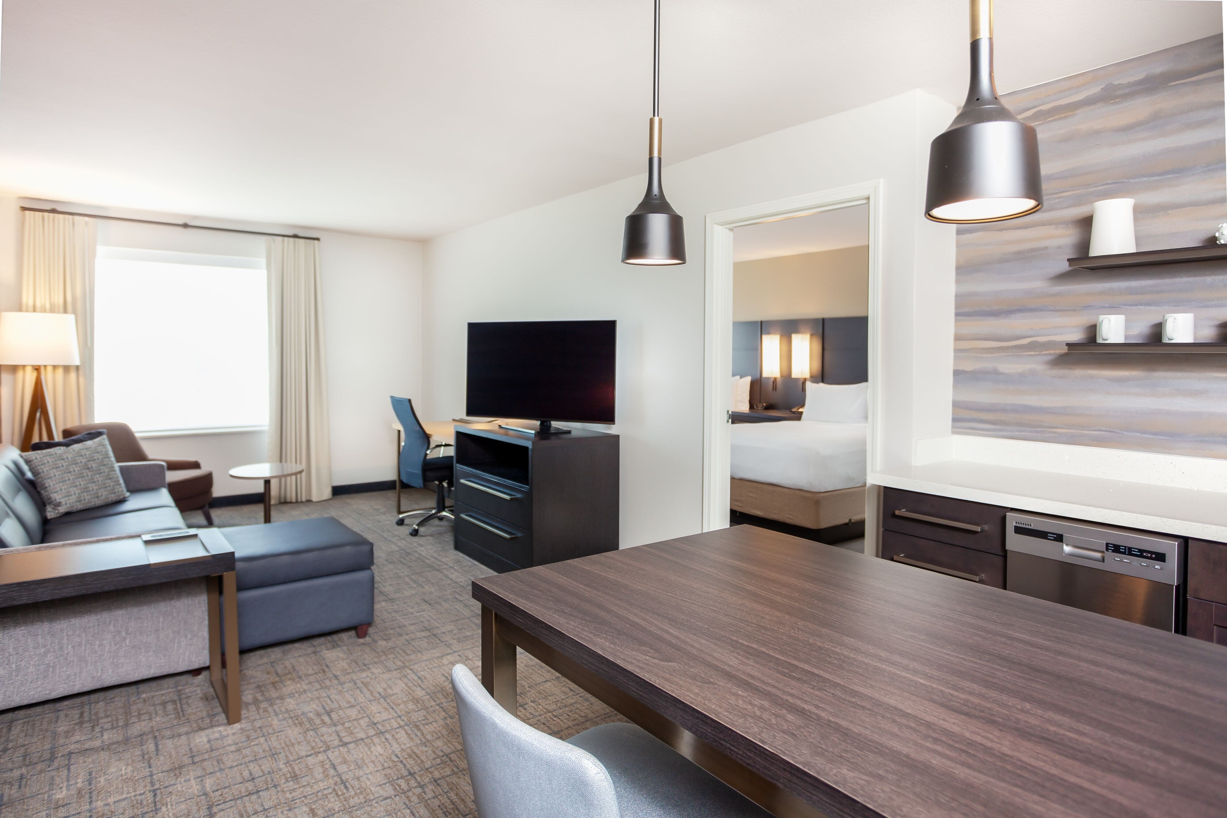 Residence Inn by Marriott Livermore-guestroom-living area & kitchen separate from sleeping room.jpg