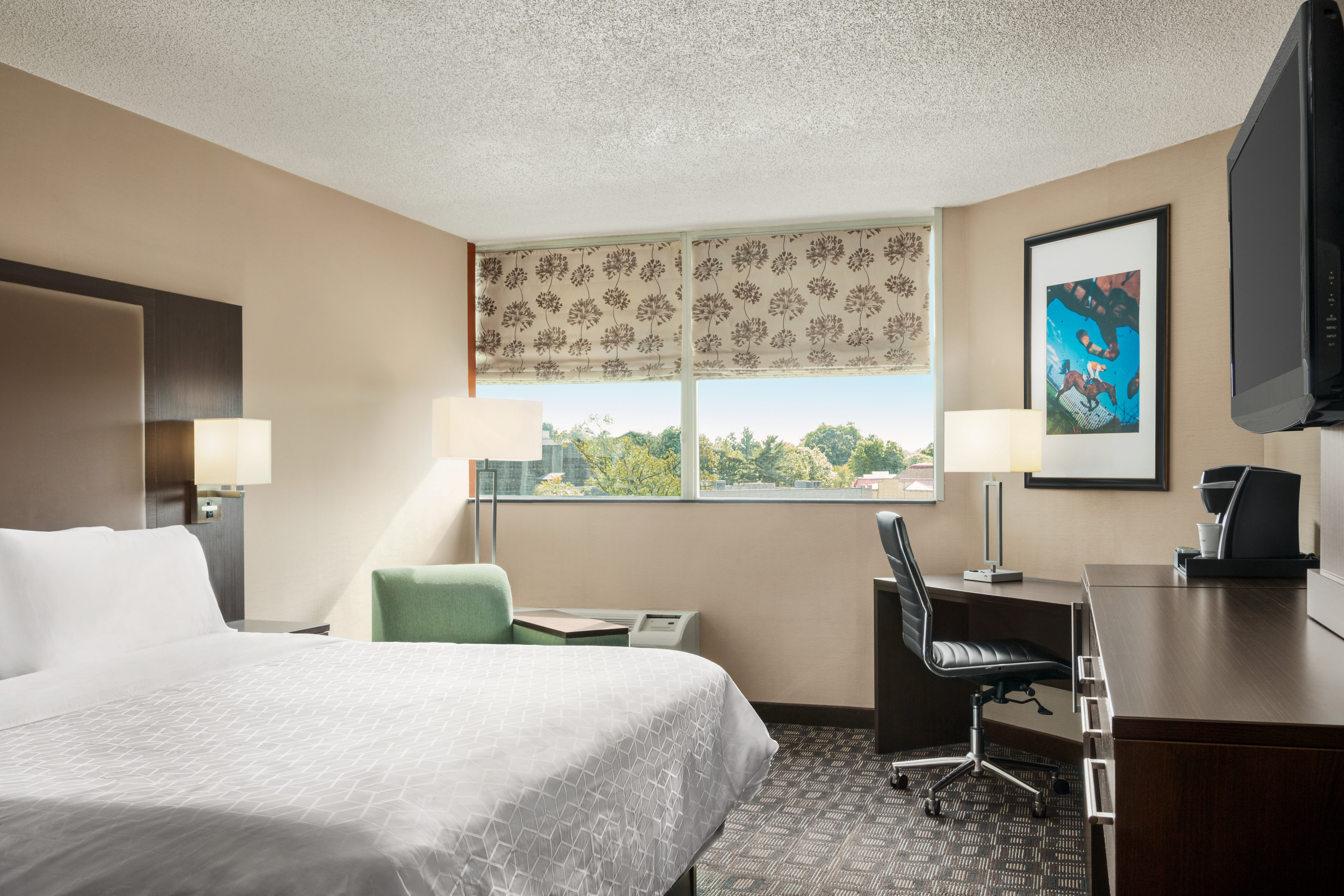 Unwind in our King Bed Guest Room with a business chair and desk.