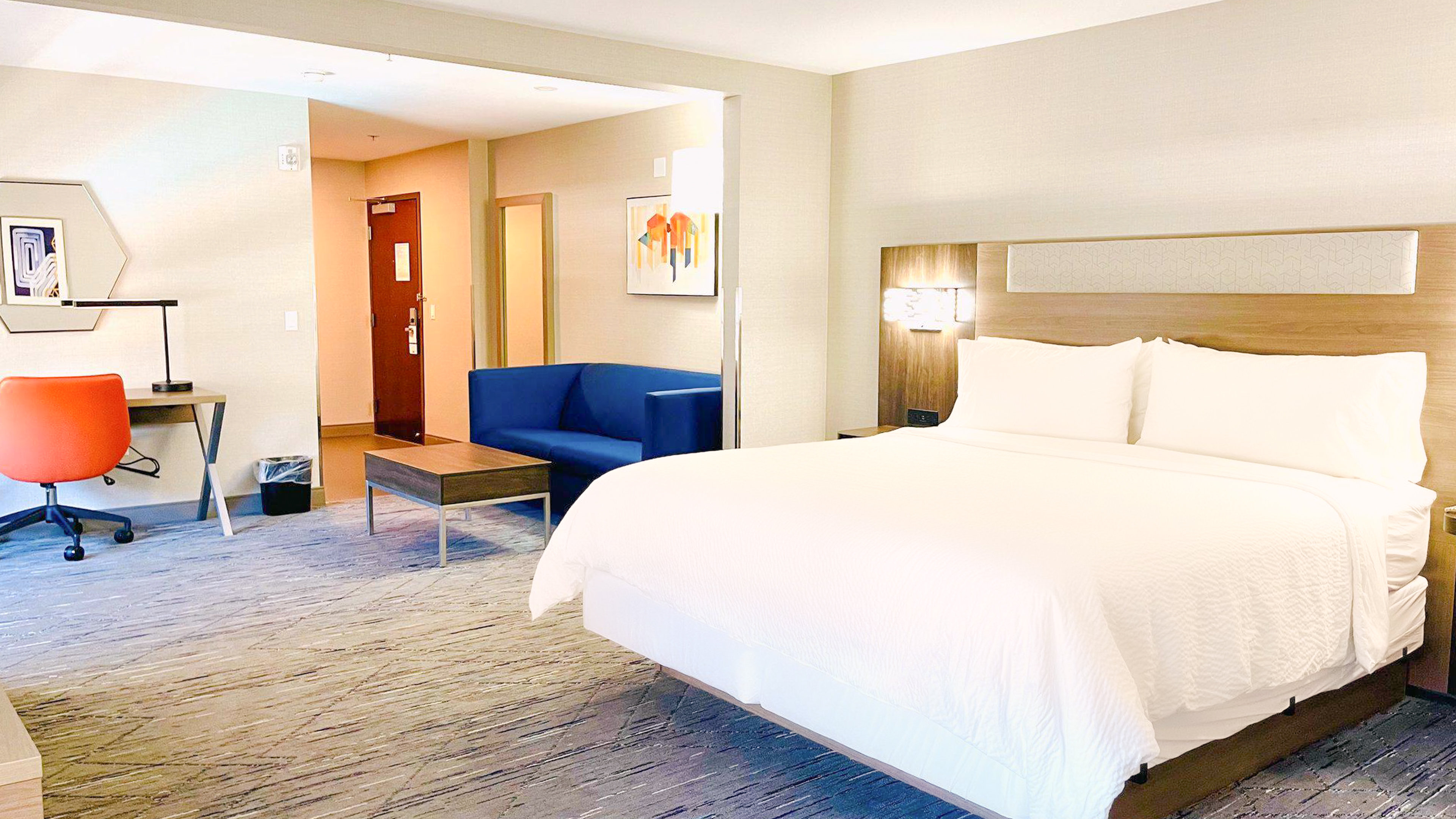 HOLIDAY INN EXP STES FRAZIER P BY I-guestroom-Relax in our spacious king suite with a pullout sofa..jpg