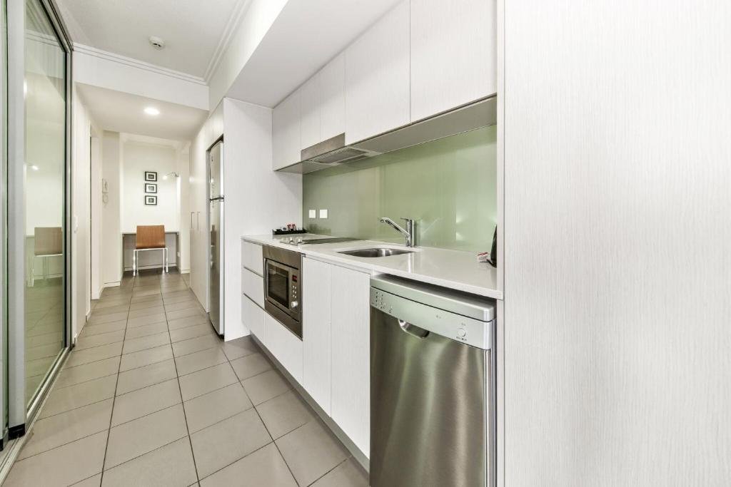 The Capitol Apartments-guestroom-Bedroom Kitchen Area.jpg