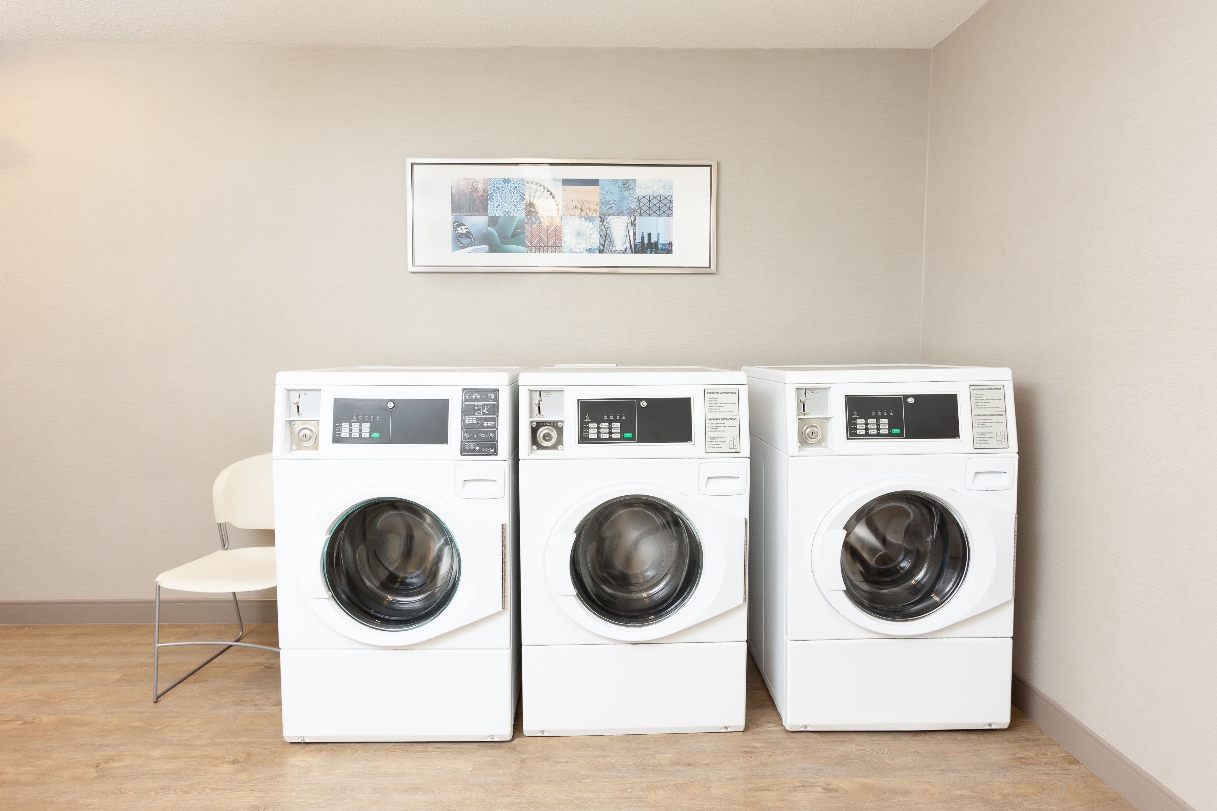 coin operated washing machines in laundry room