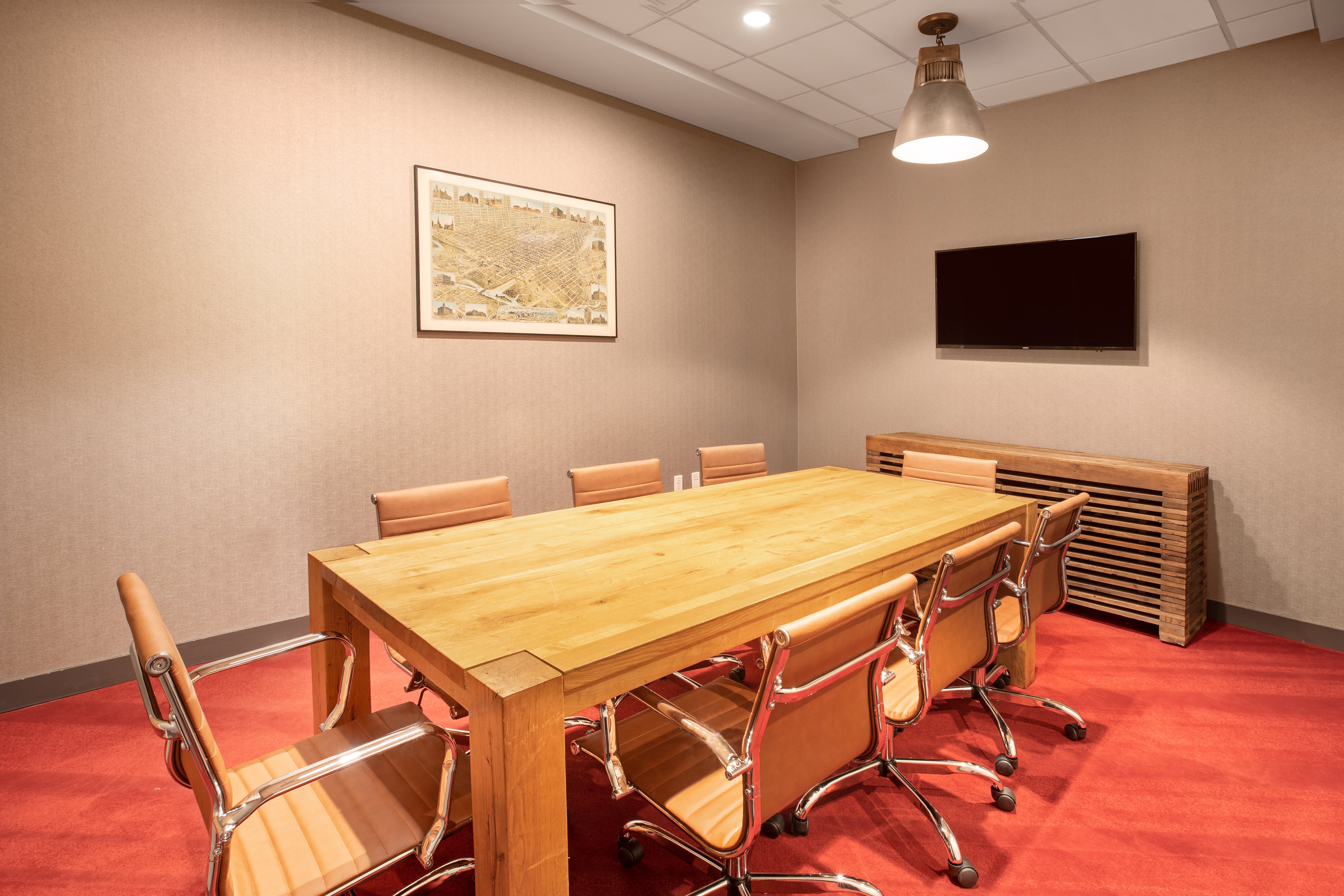 Boardroom with flat screen and comfortable seating up to 8