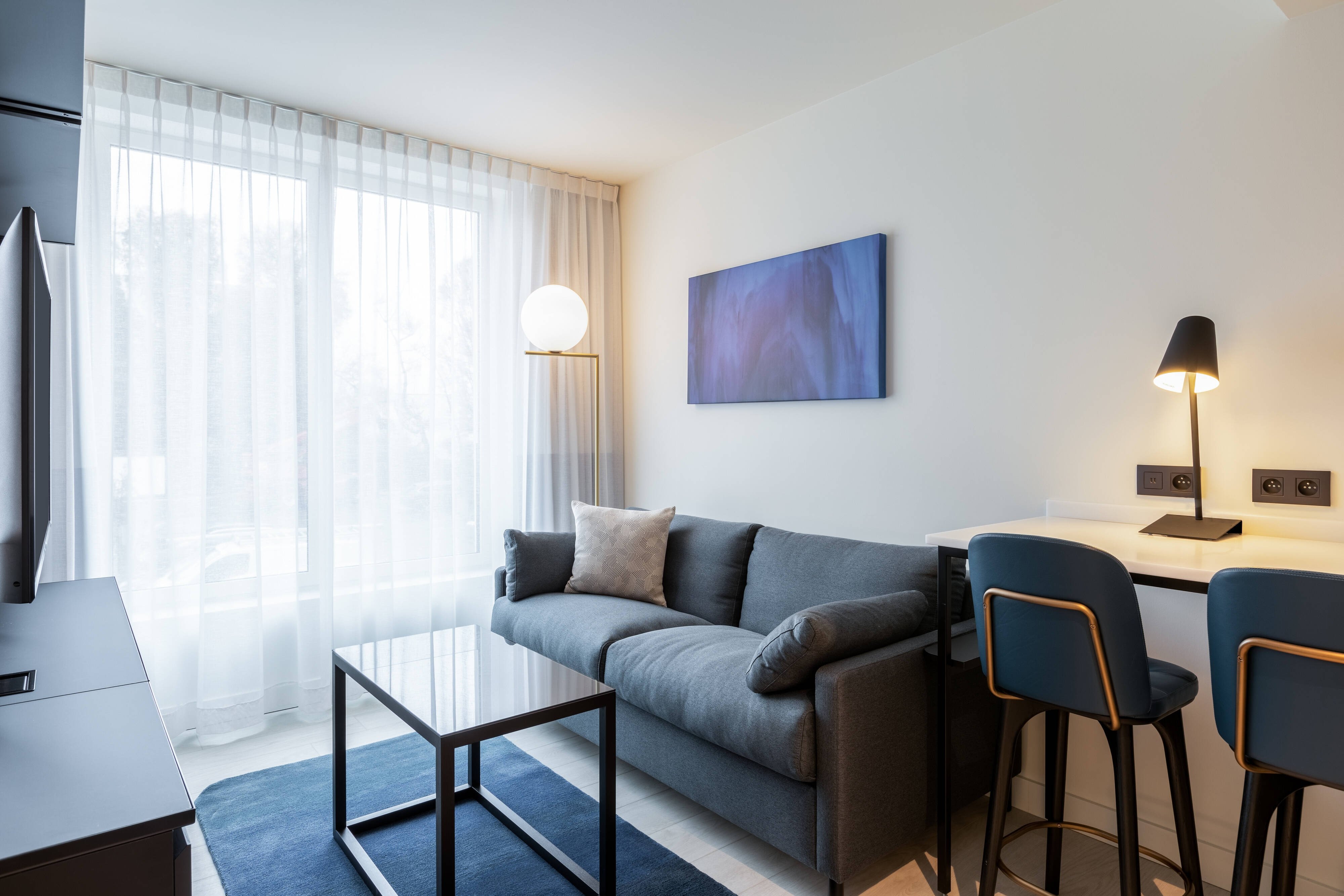 Residence Inn by Marriott Ghent-guestroom-King Studio Suite - Living Area.jpg