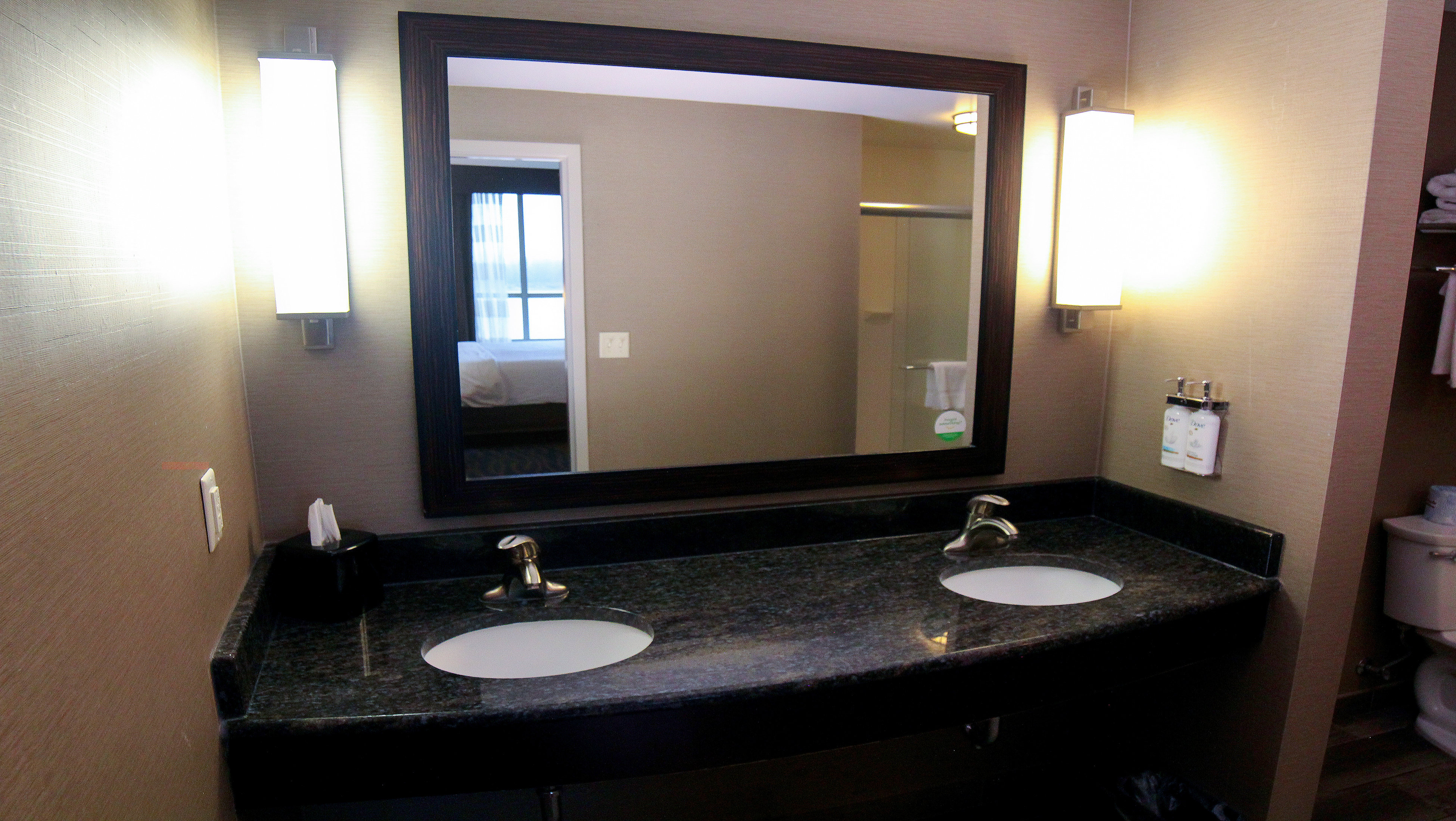 Our King Bedroom Suite offers two vanity sinks and dove products